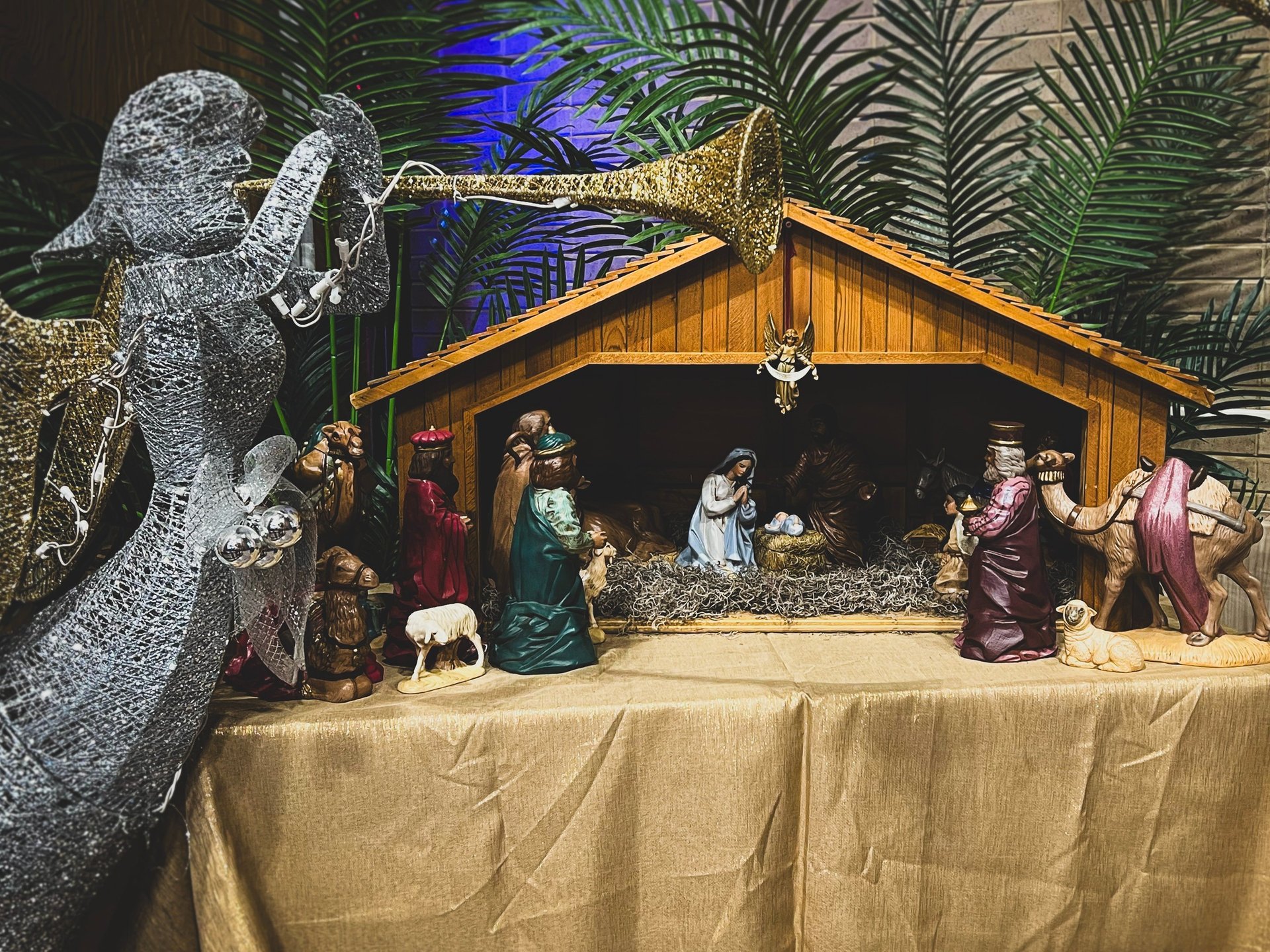 a nativity scene of two figurines on a donkey