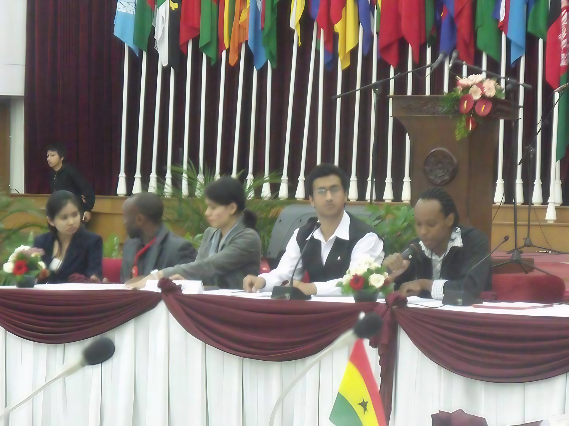 an abstract photo of a curved building with a blue sky in the background