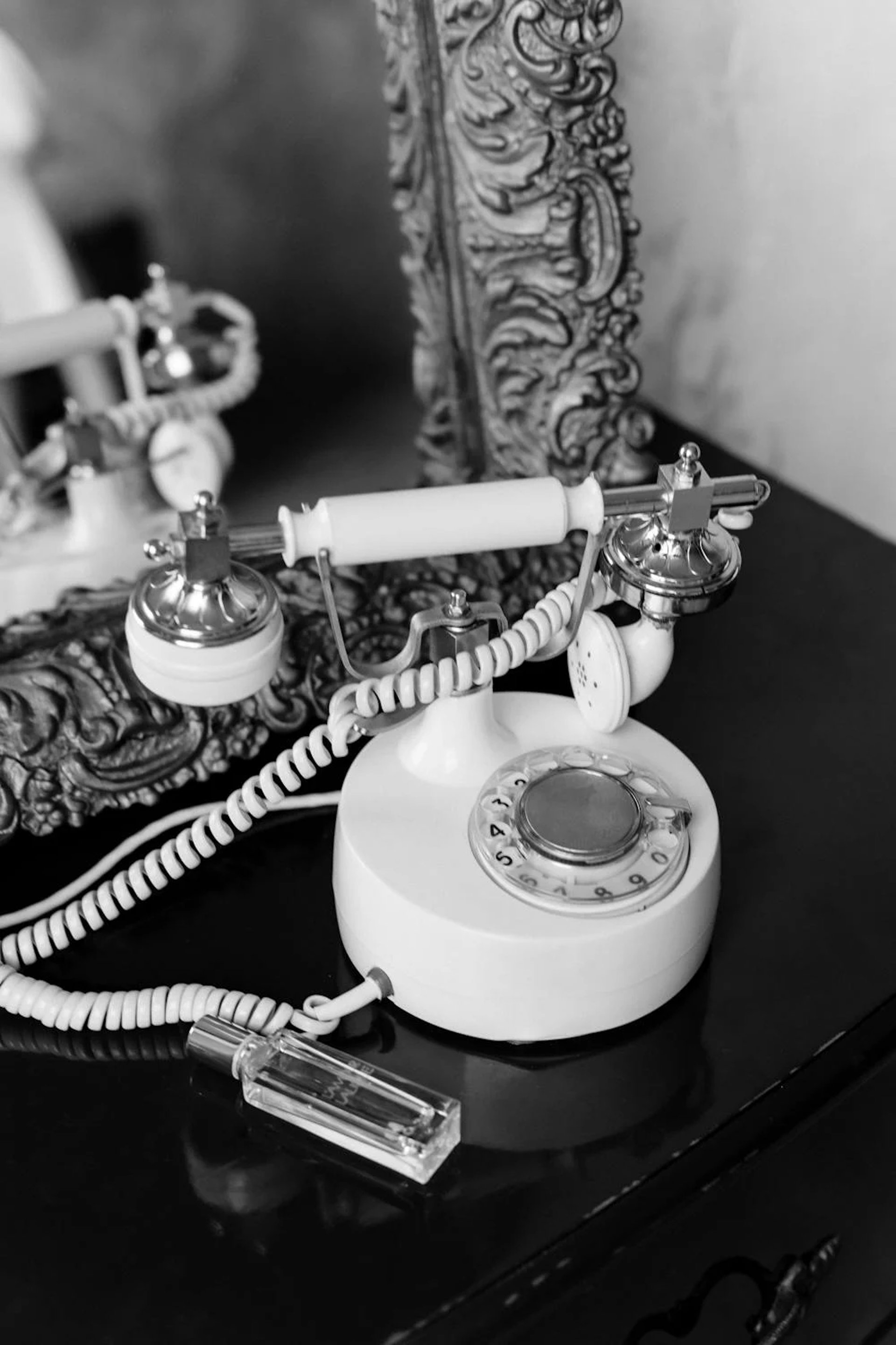 woman holding yellow rotary telephone