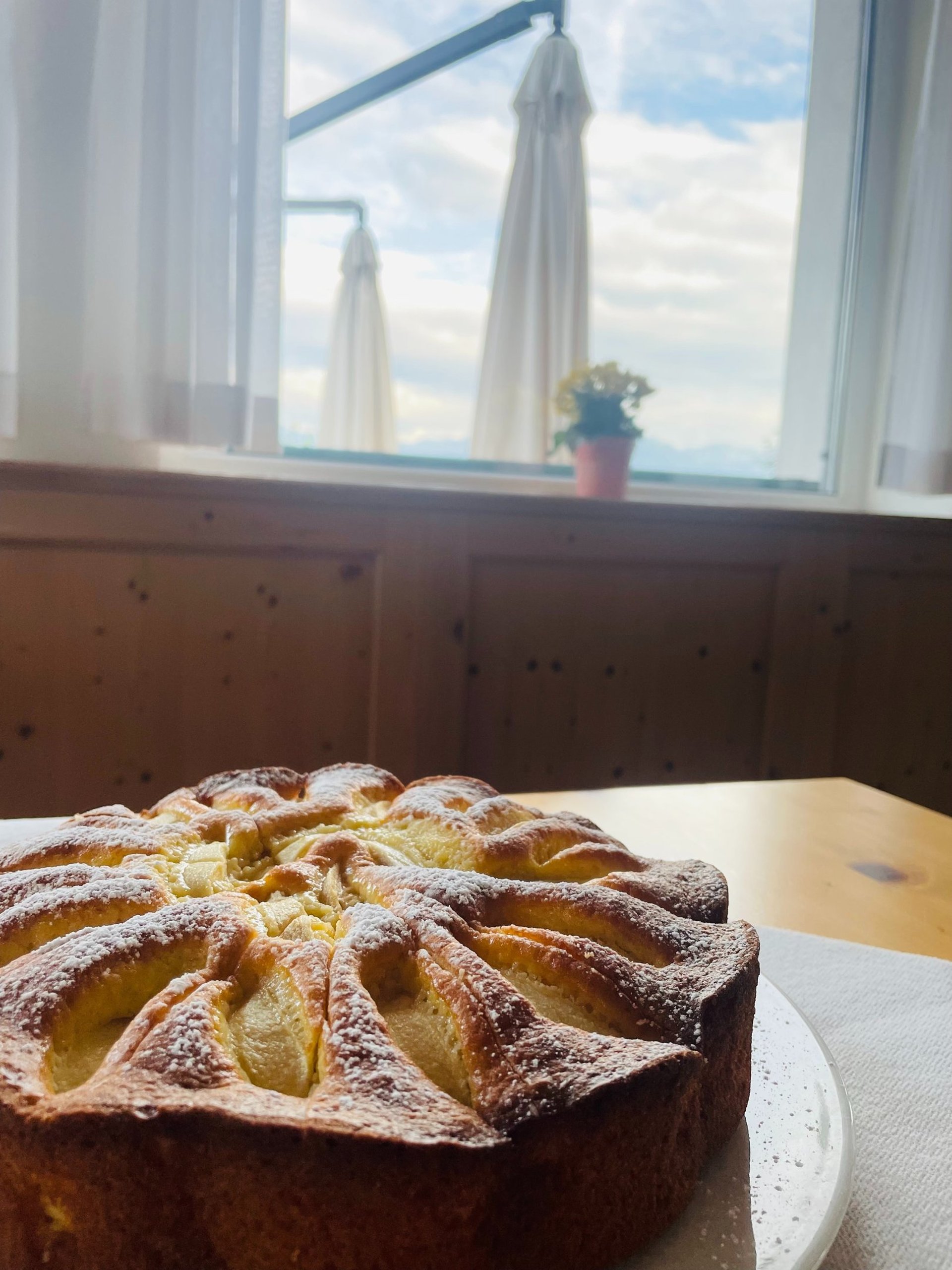 an abstract photo of a curved building with a blue sky in the background