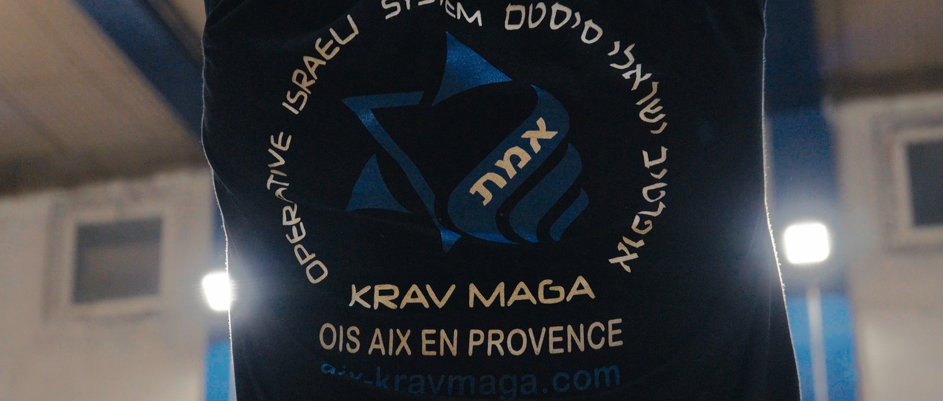 red volkswagen beetle parked on gray asphalt road during daytime