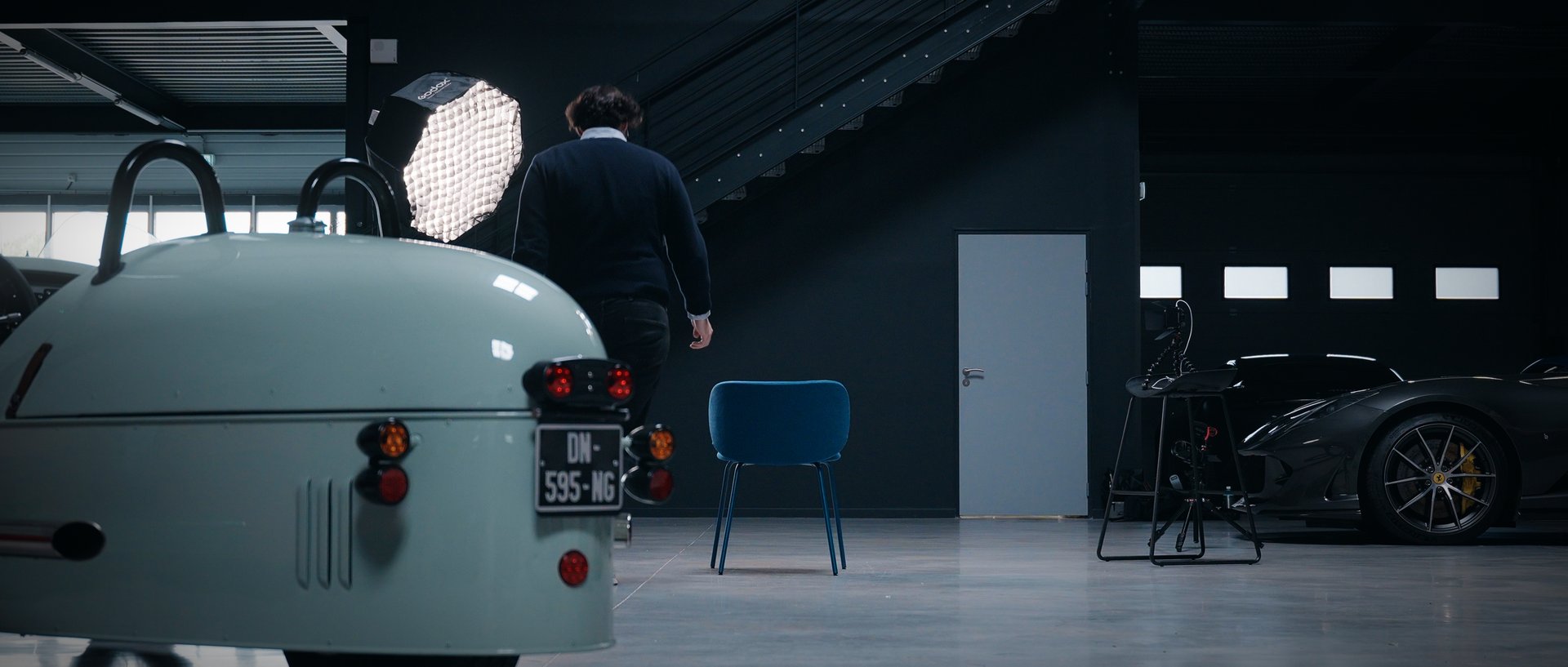 red volkswagen beetle parked on gray asphalt road during daytime