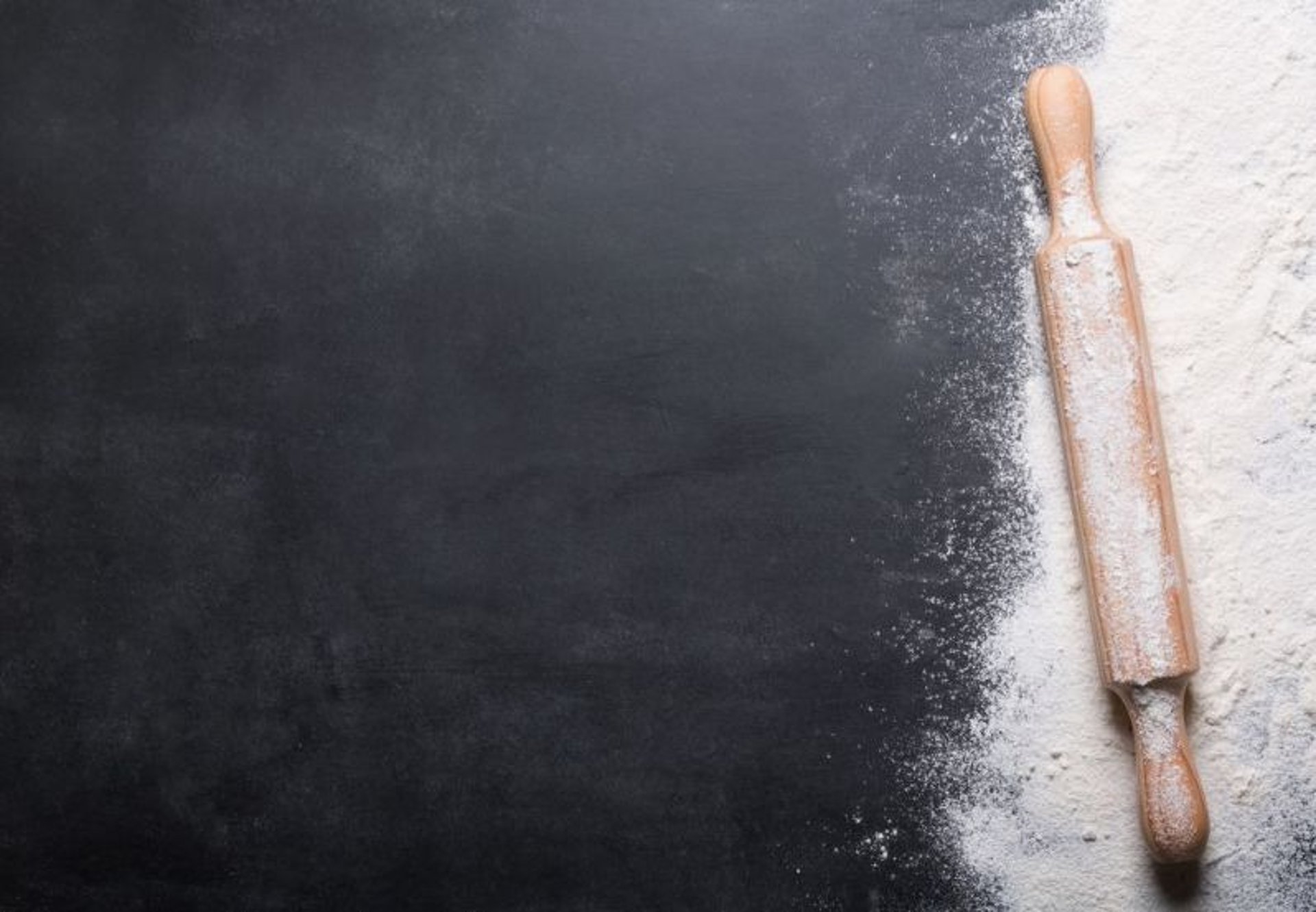 rolling pin in flour background