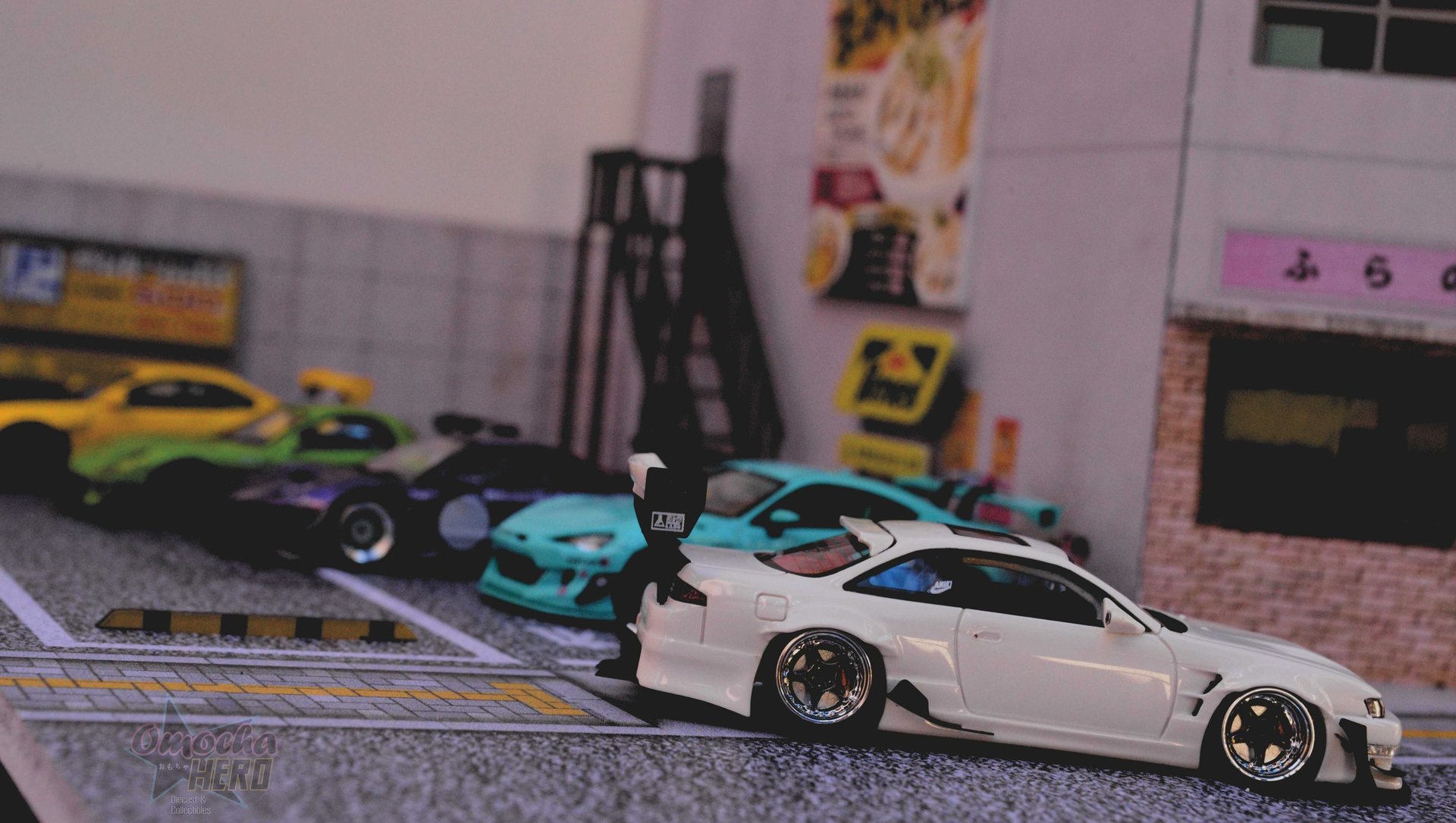 white car on black asphalt road during daytime