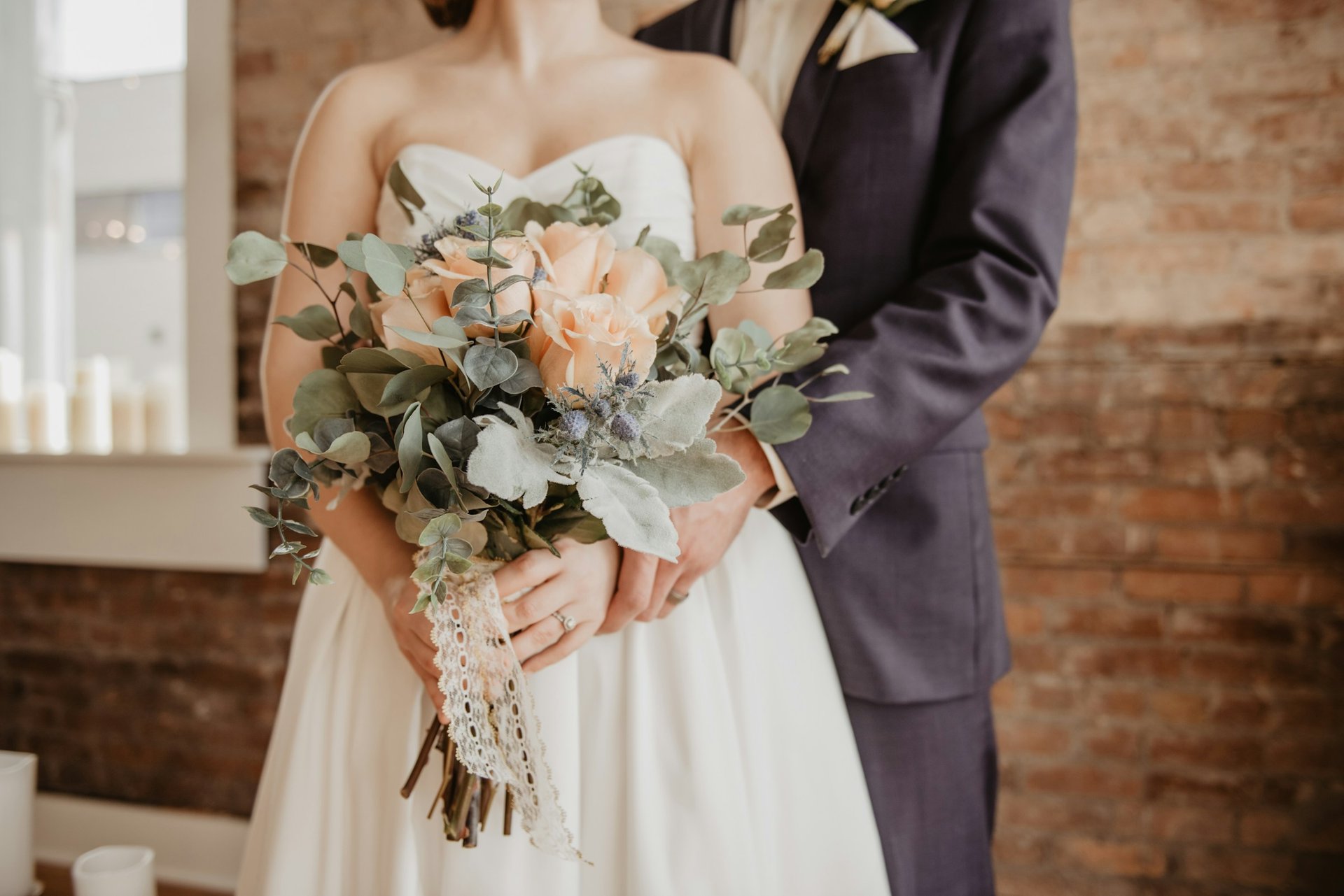 couple wearing silver-colored rings