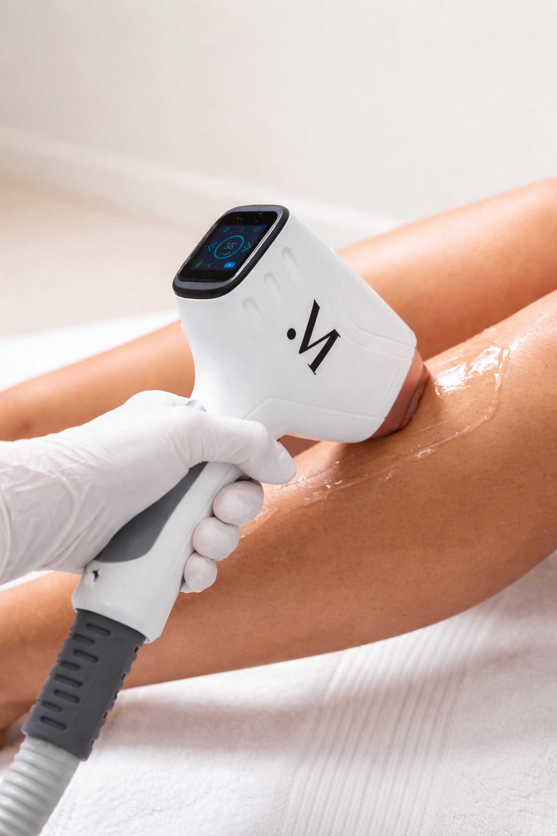 an abstract photo of a curved building with a blue sky in the background