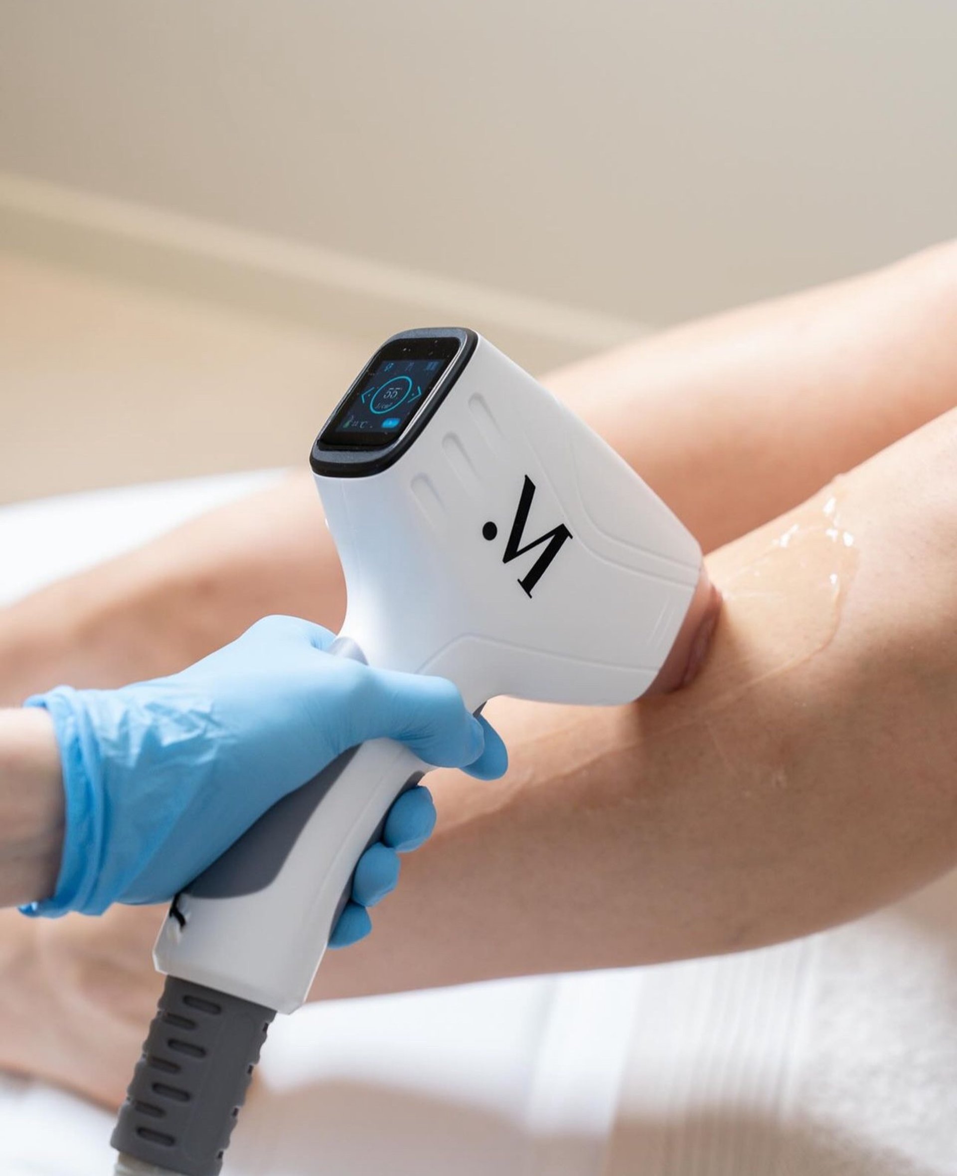 an abstract photo of a curved building with a blue sky in the background