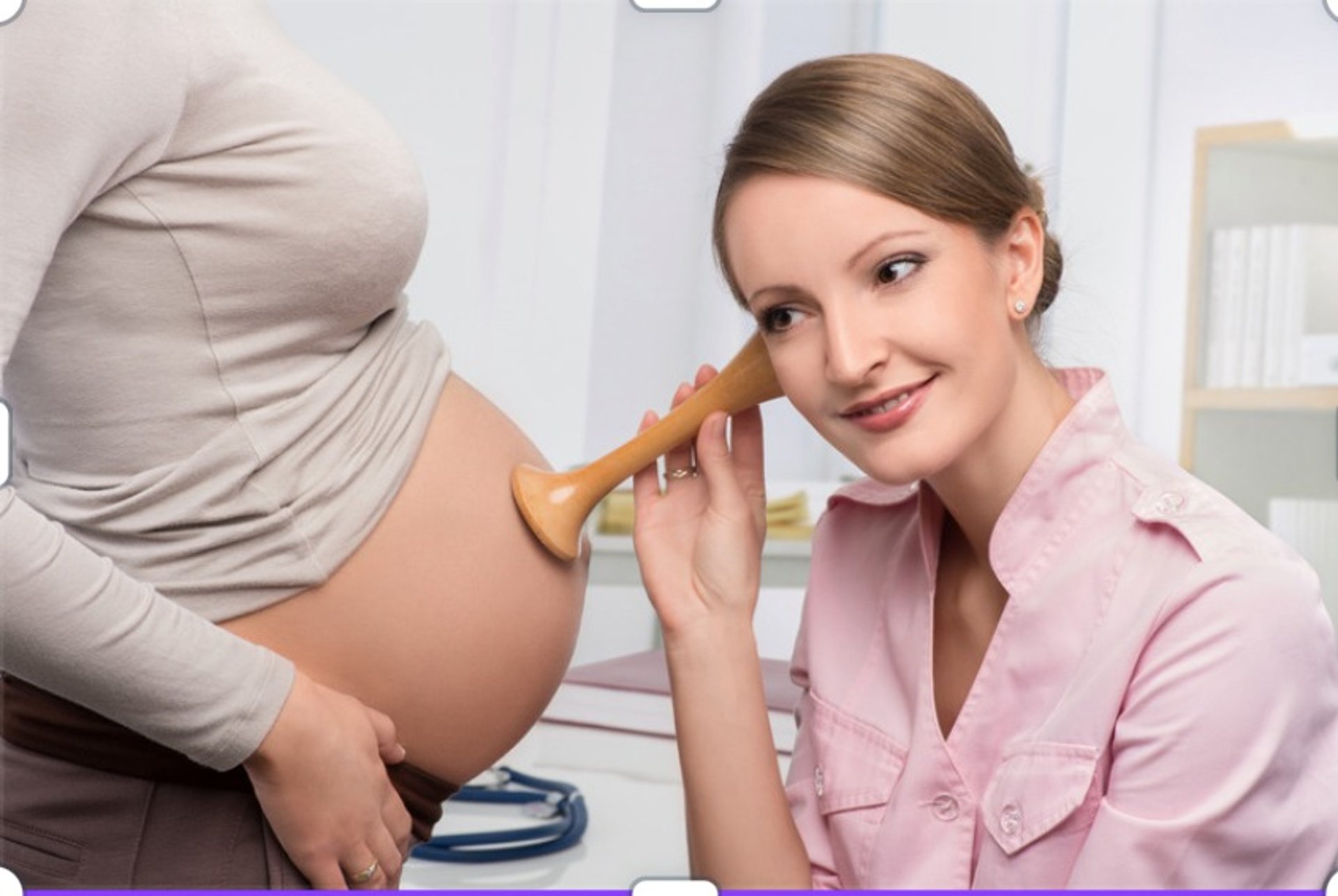 A woman holding a baby up in the air