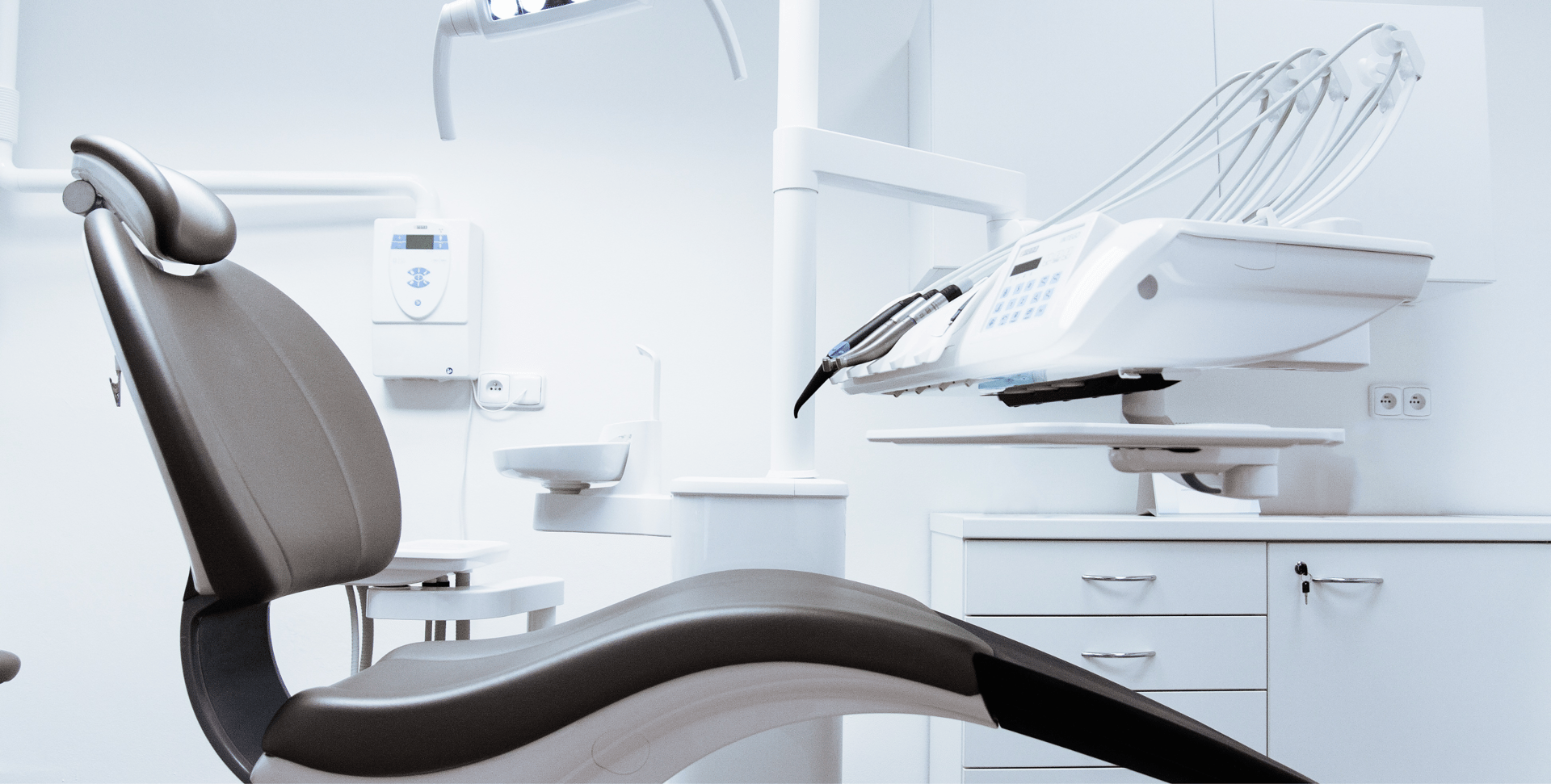 an abstract photo of a curved building with a blue sky in the background