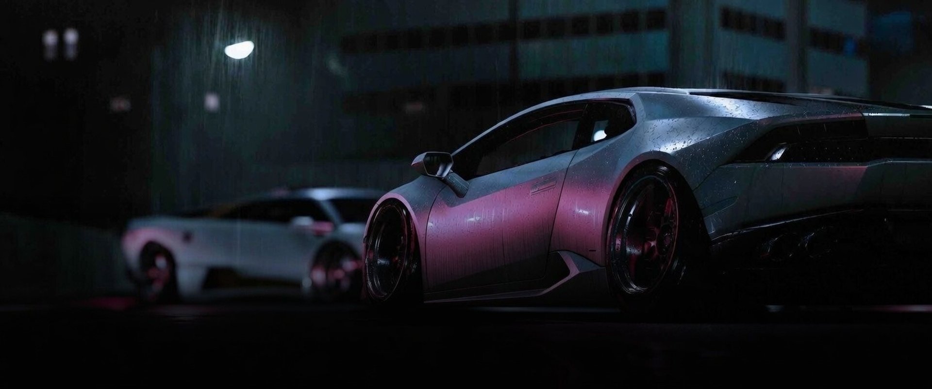 a car parked on the side of a street at night