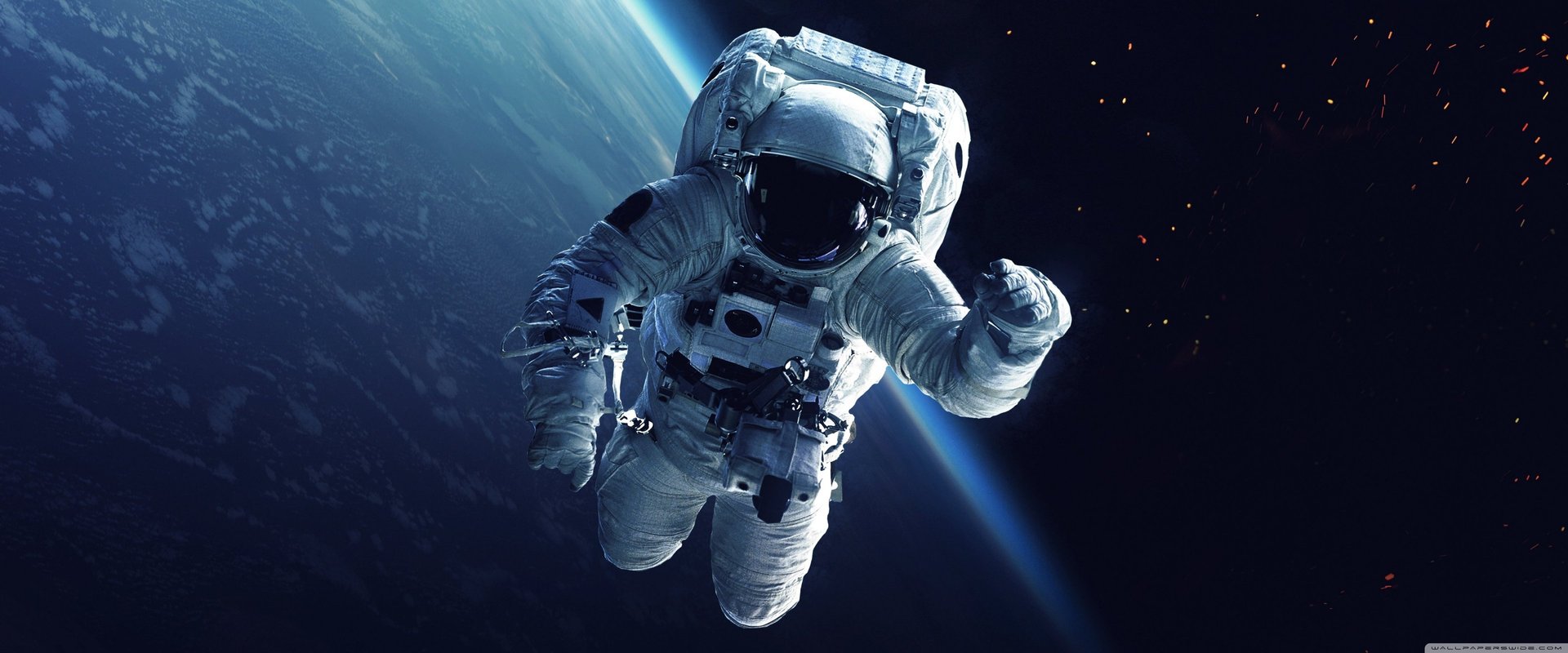 an abstract photo of a curved building with a blue sky in the background