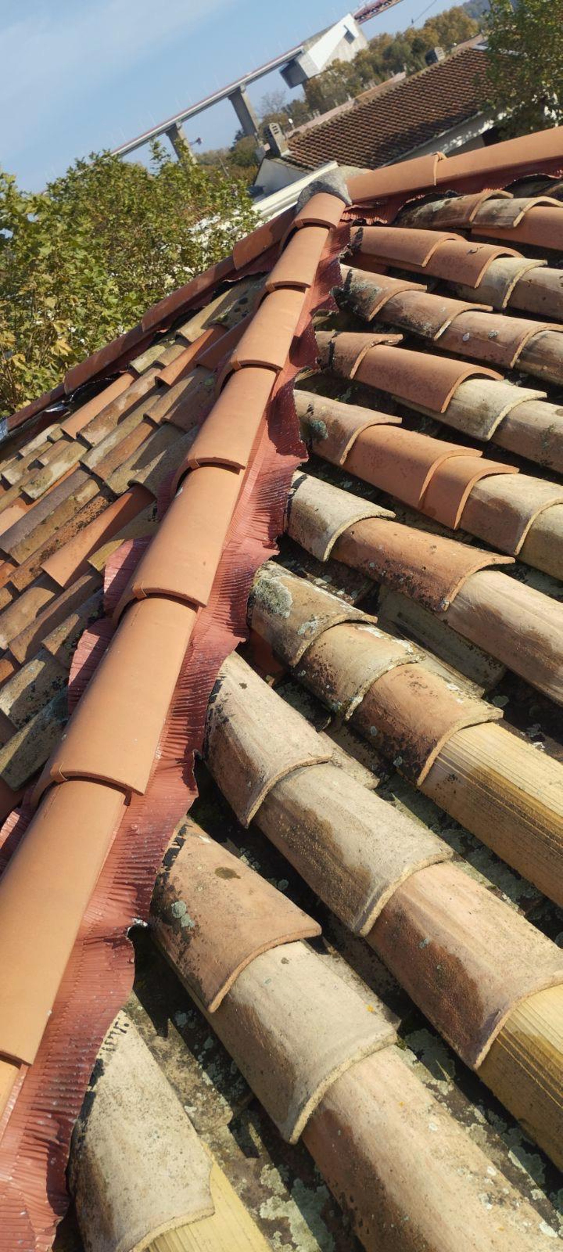 A man on a roof working on a roof