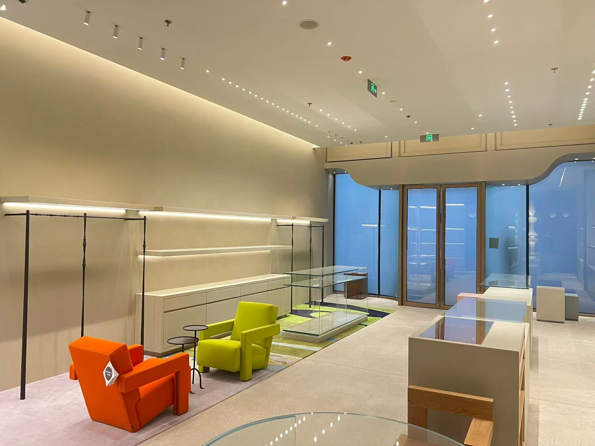 an abstract photo of a curved building with a blue sky in the background