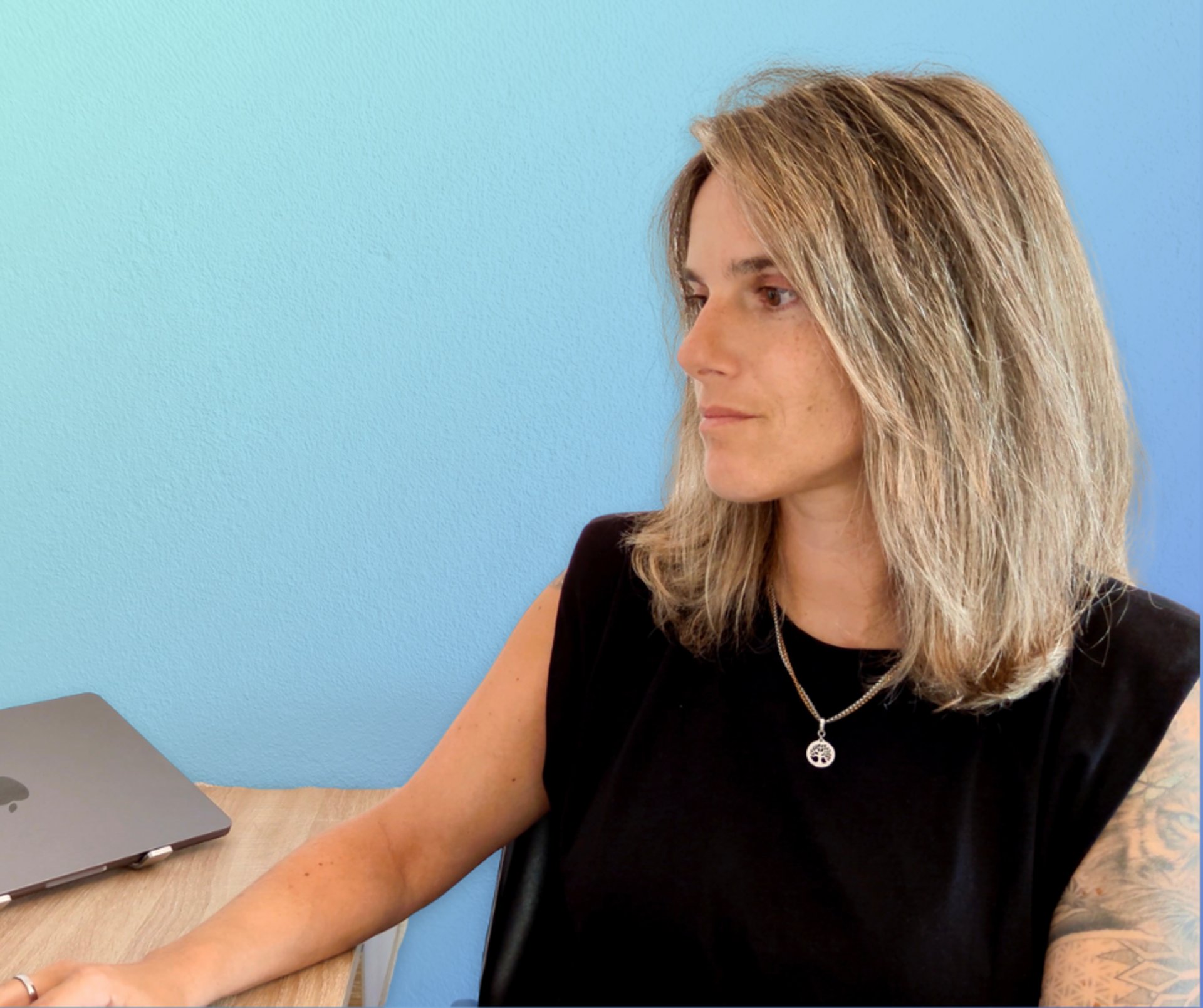 an abstract photo of a curved building with a blue sky in the background