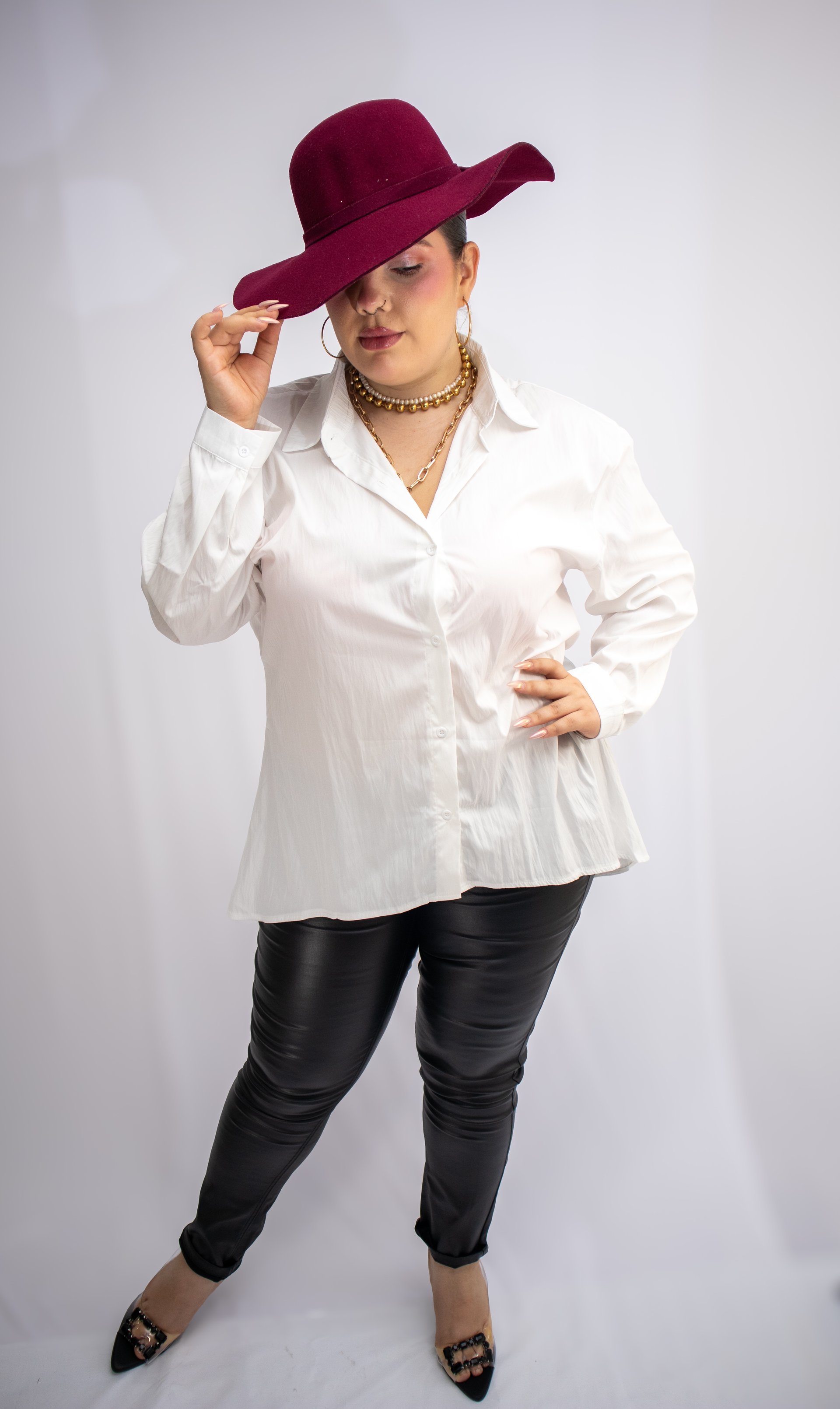 woman wearing yellow long-sleeved dress under white clouds and blue sky during daytime
