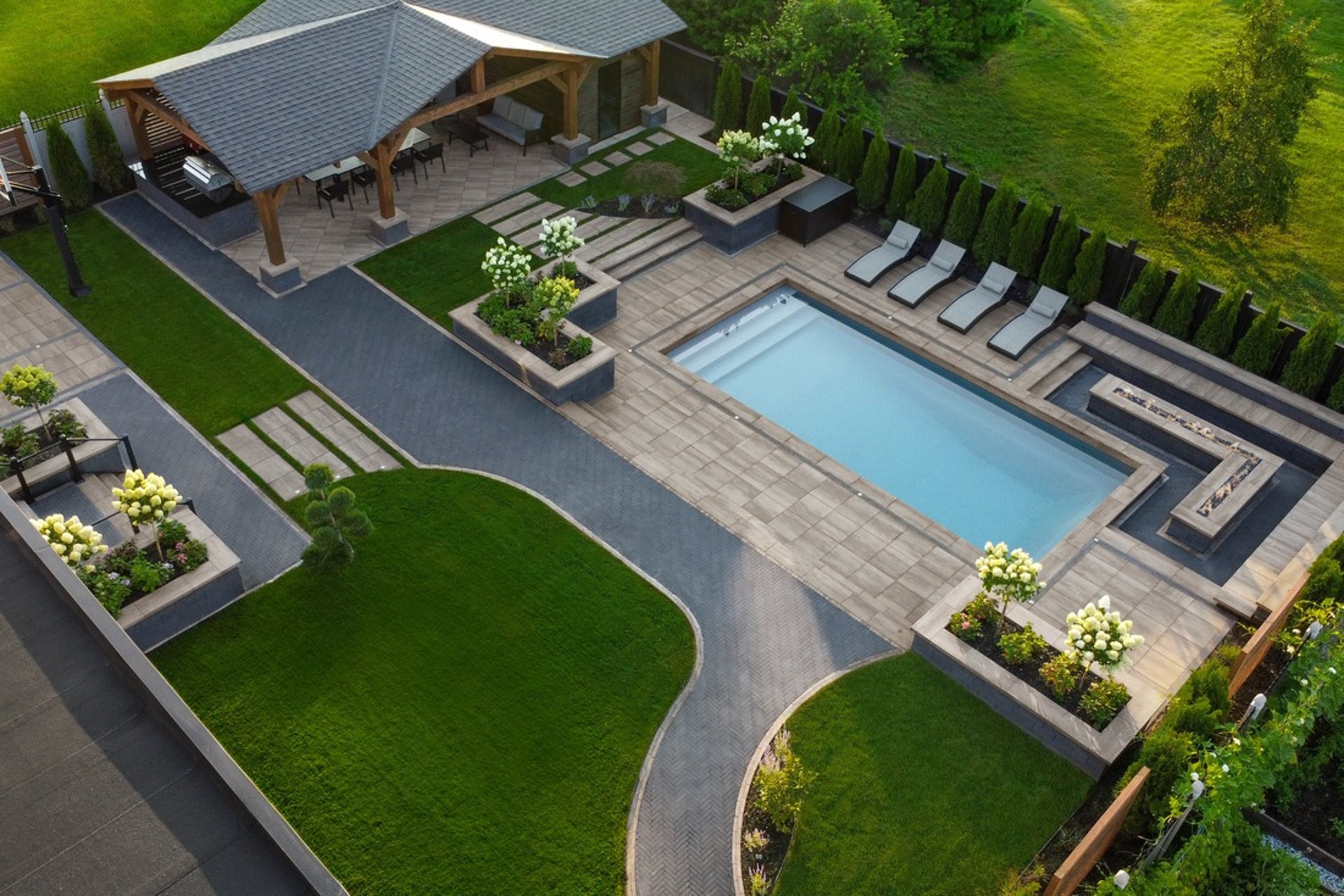 an abstract photo of a curved building with a blue sky in the background