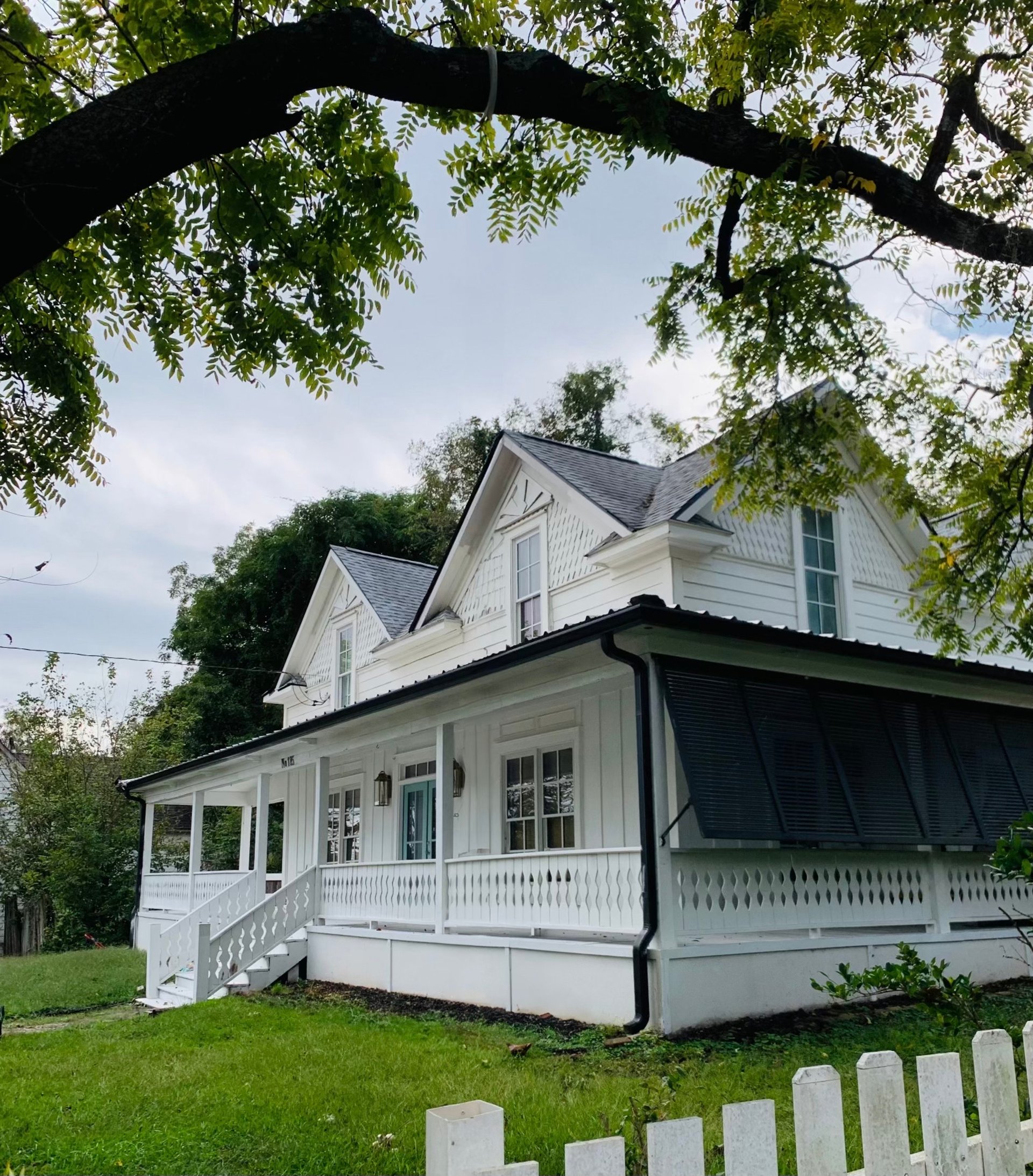 black and brown leather padded tub sofa