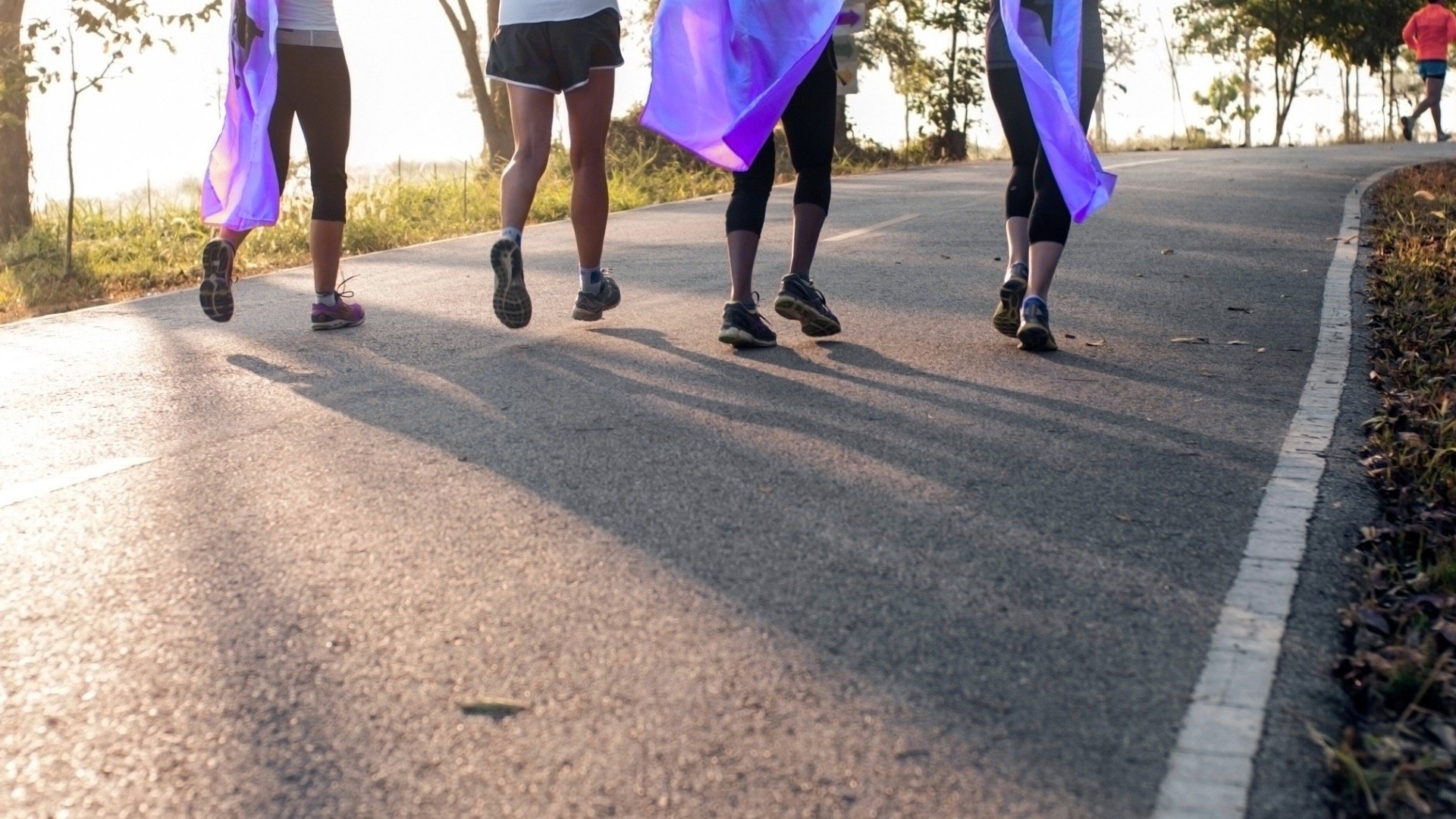 hands formed together with red heart paint