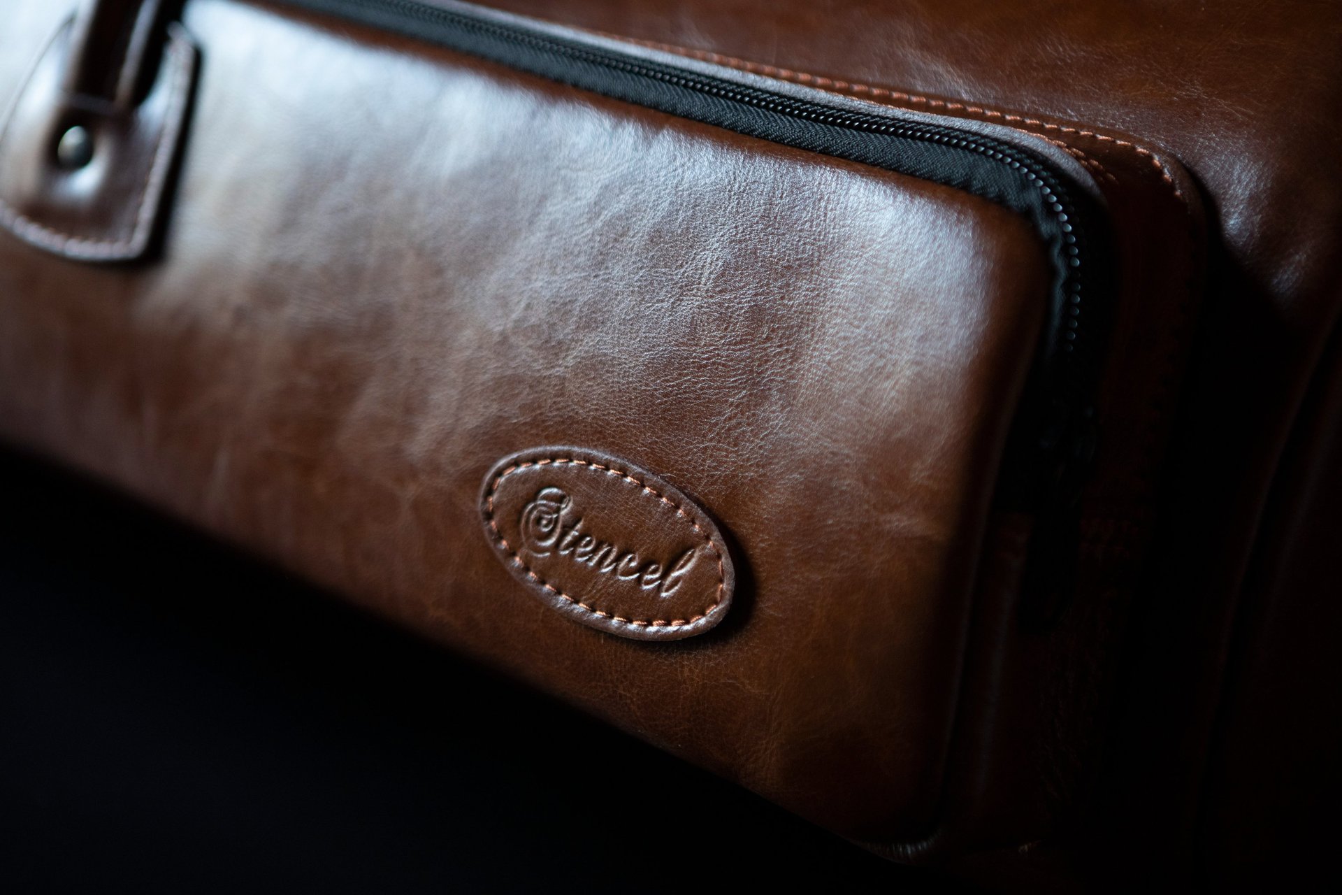 a black and white photo of a cat sitting on a window sill