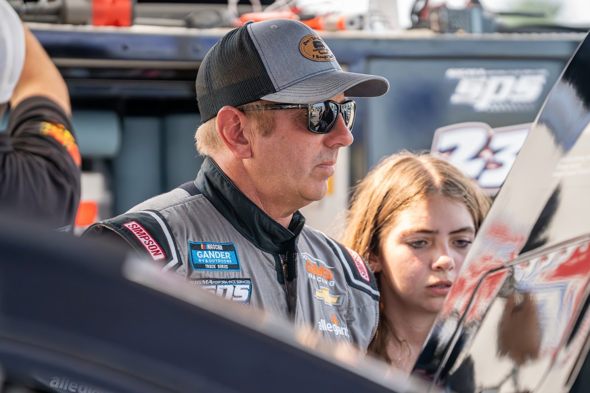 an abstract photo of a curved building with a blue sky in the background