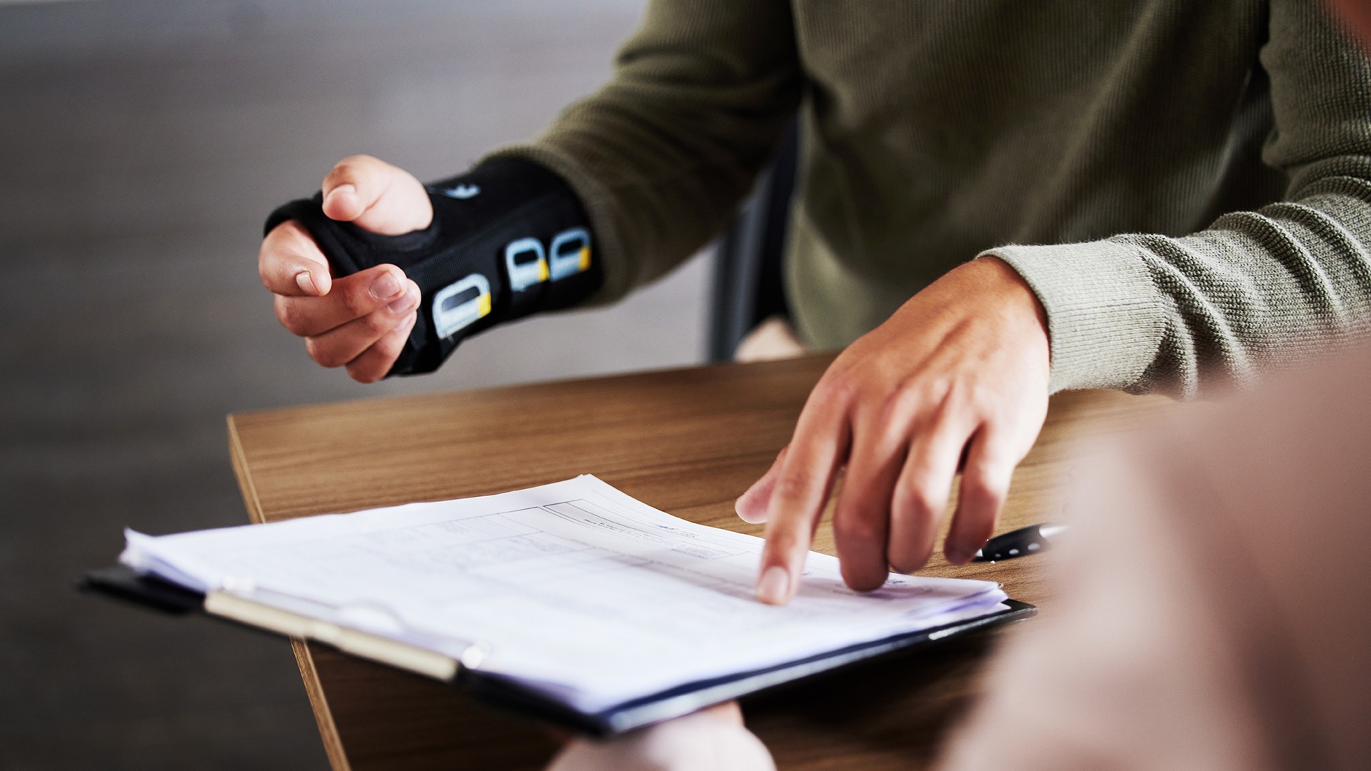 A pregnant woman standing in her crib