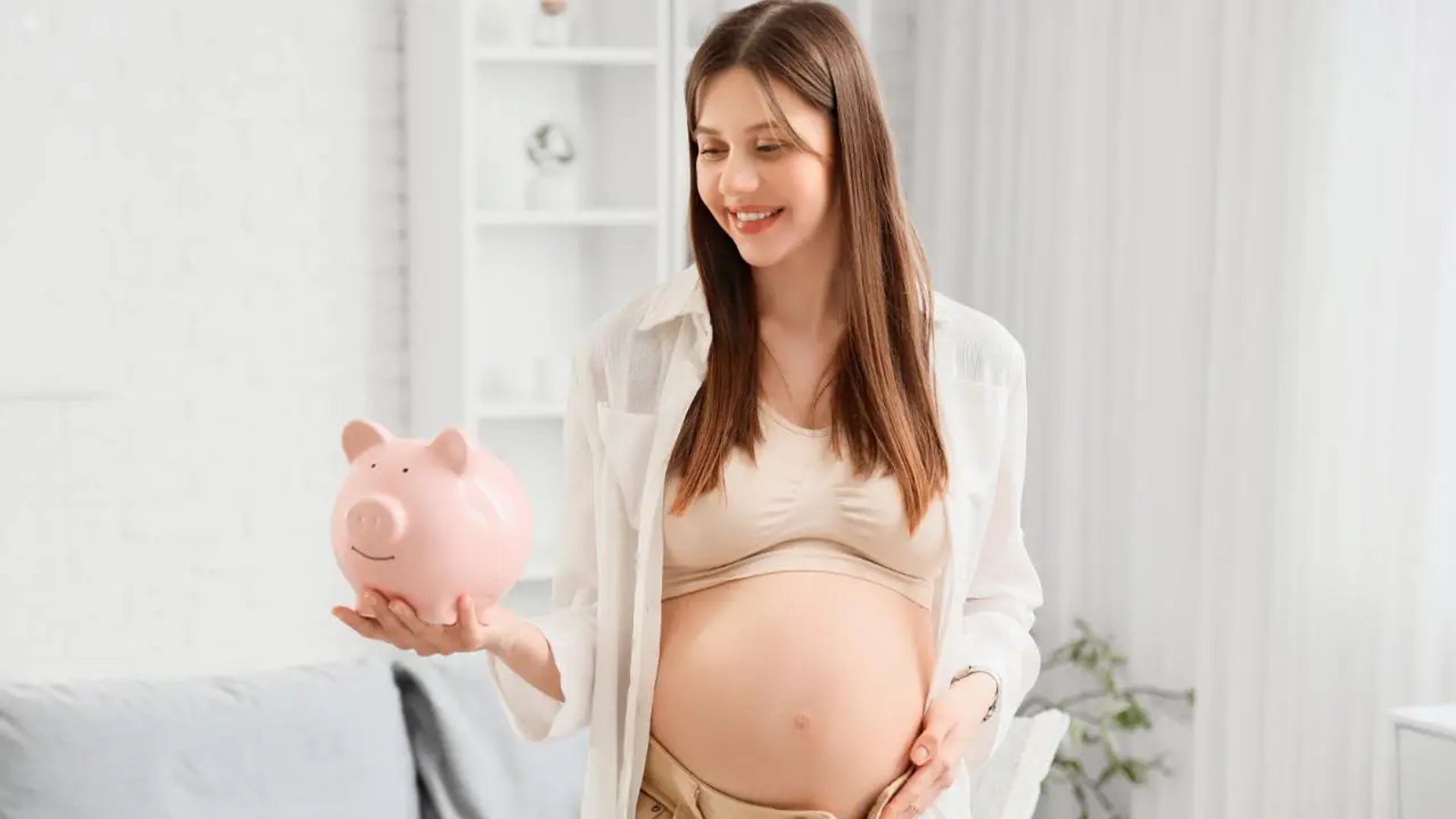 A pregnant woman standing in her crib