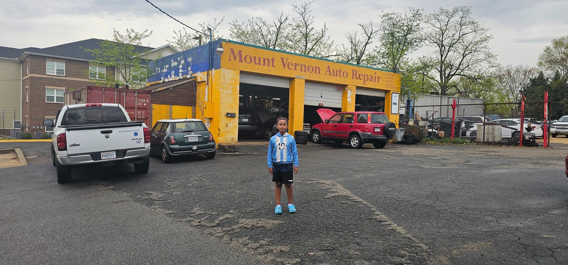 woman wearing yellow long-sleeved dress under white clouds and blue sky during daytime