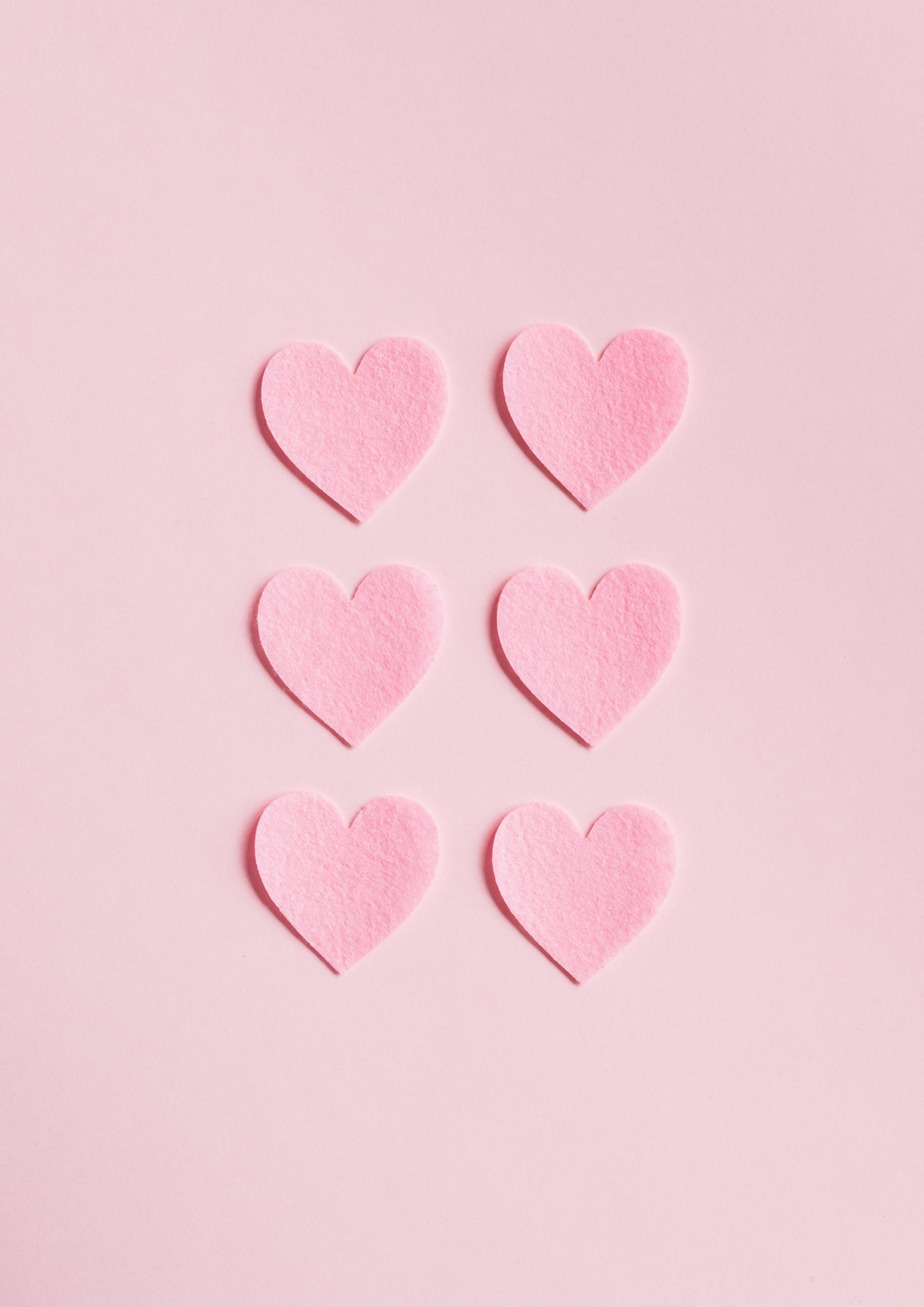 a person holding another person's hand in a hospital bed