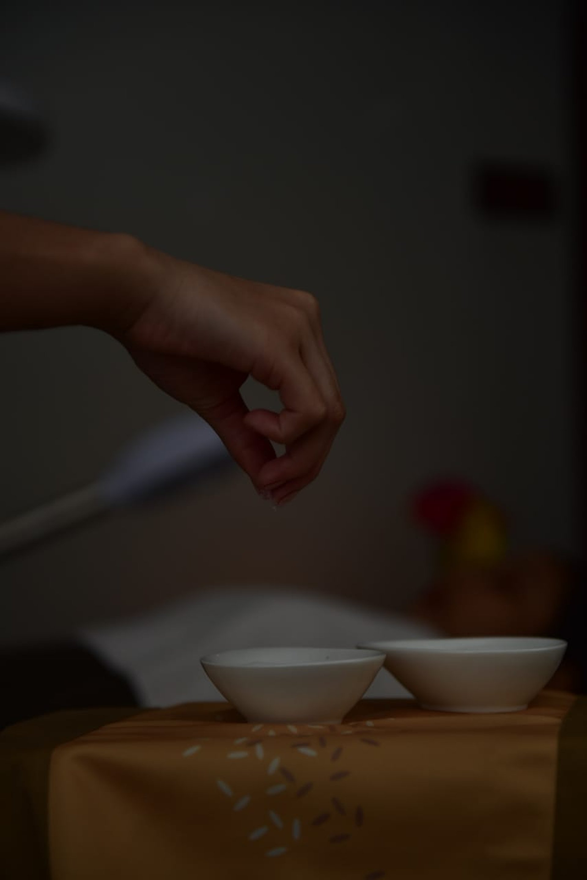 a person holding another person's hand in a hospital bed