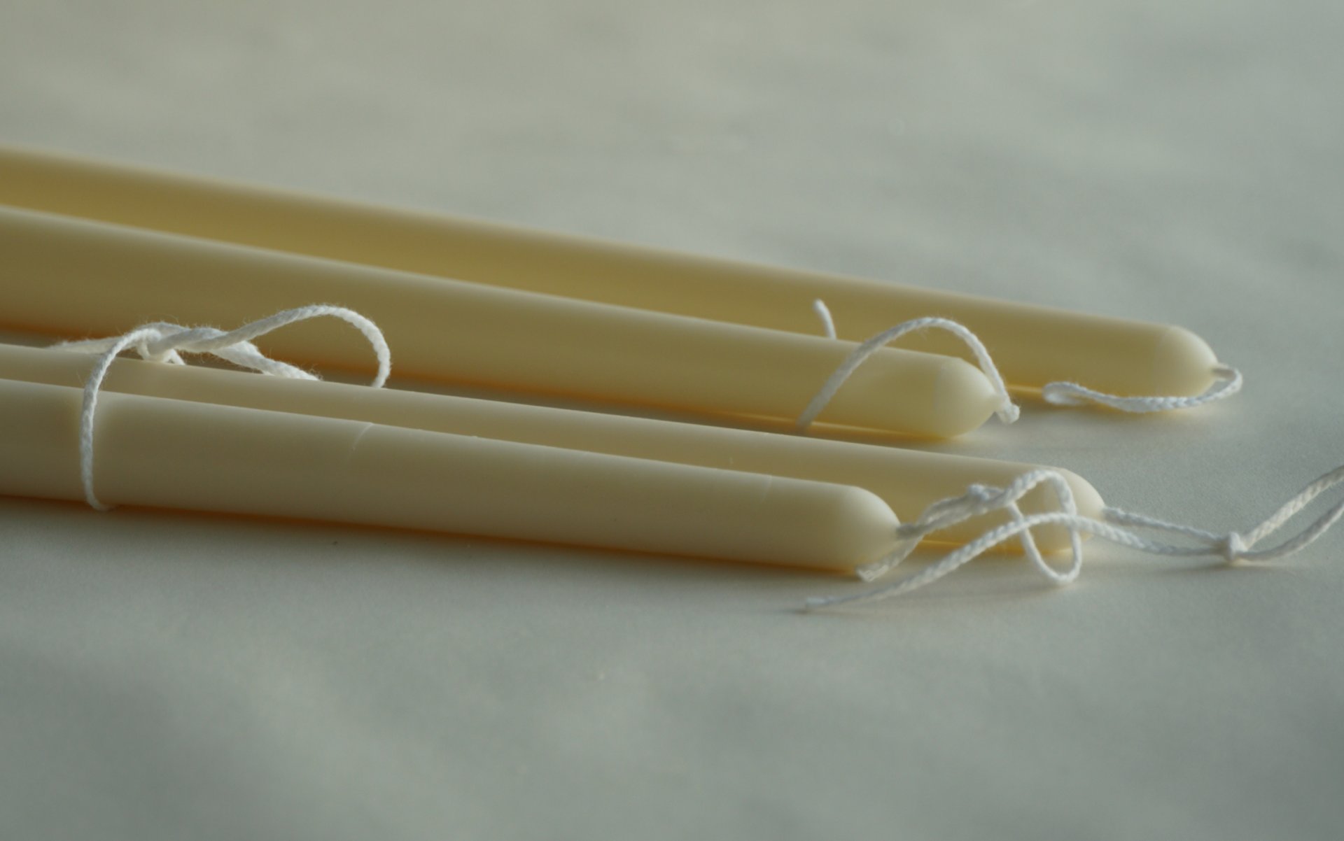 an abstract photo of a curved building with a blue sky in the background