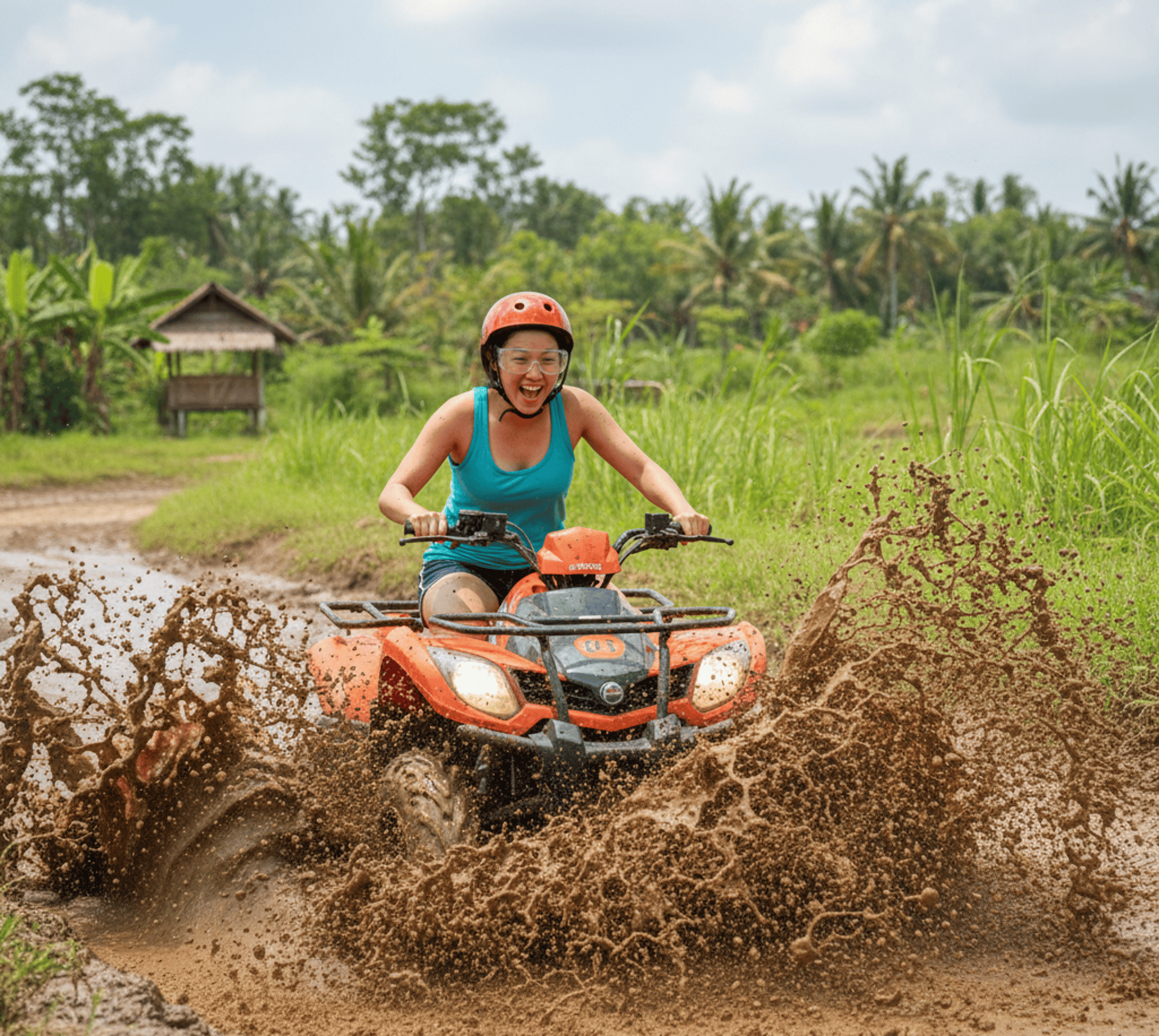 man riding red atv on brown field during daytime