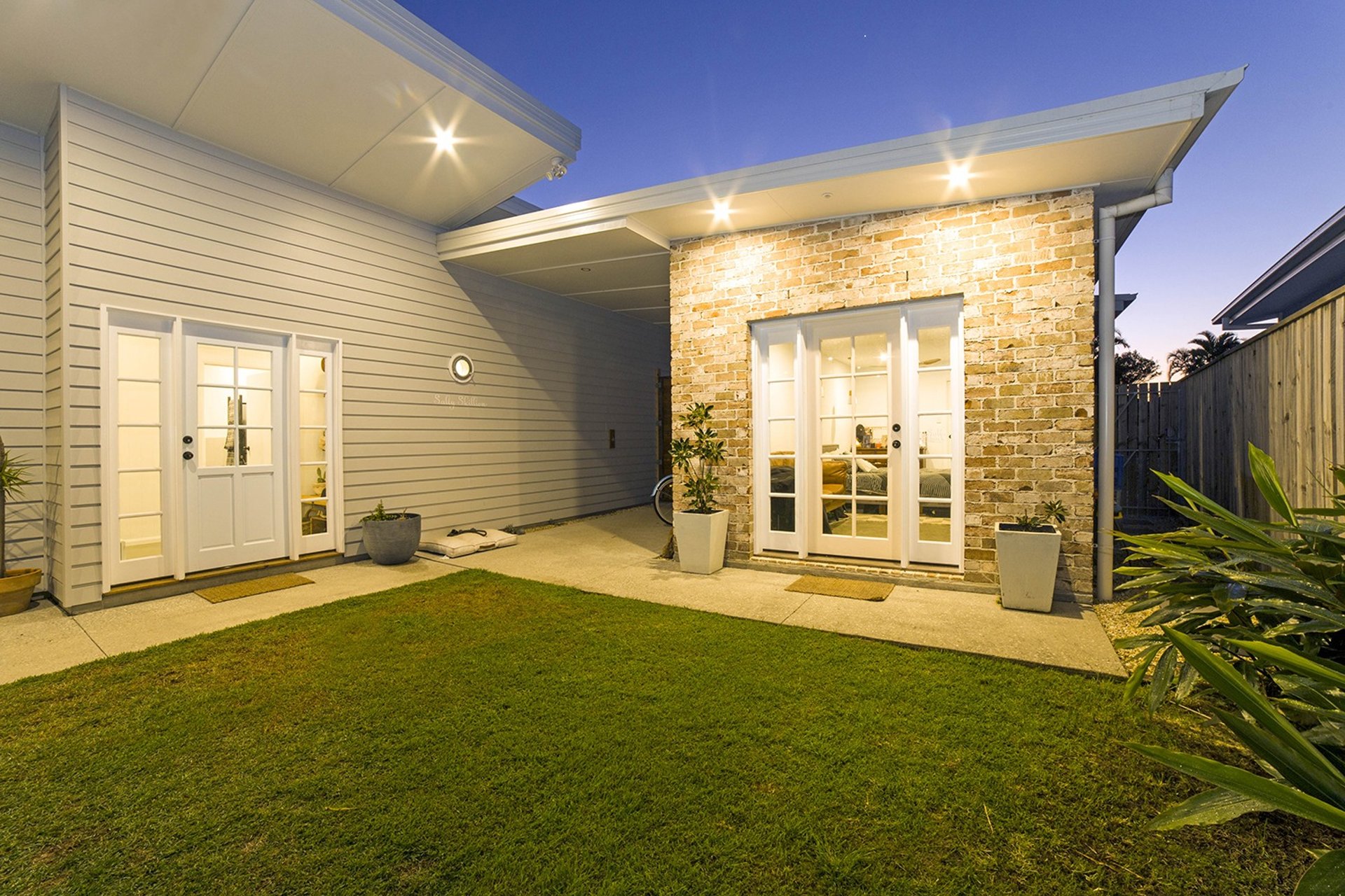 woman wearing yellow long-sleeved dress under white clouds and blue sky during daytime