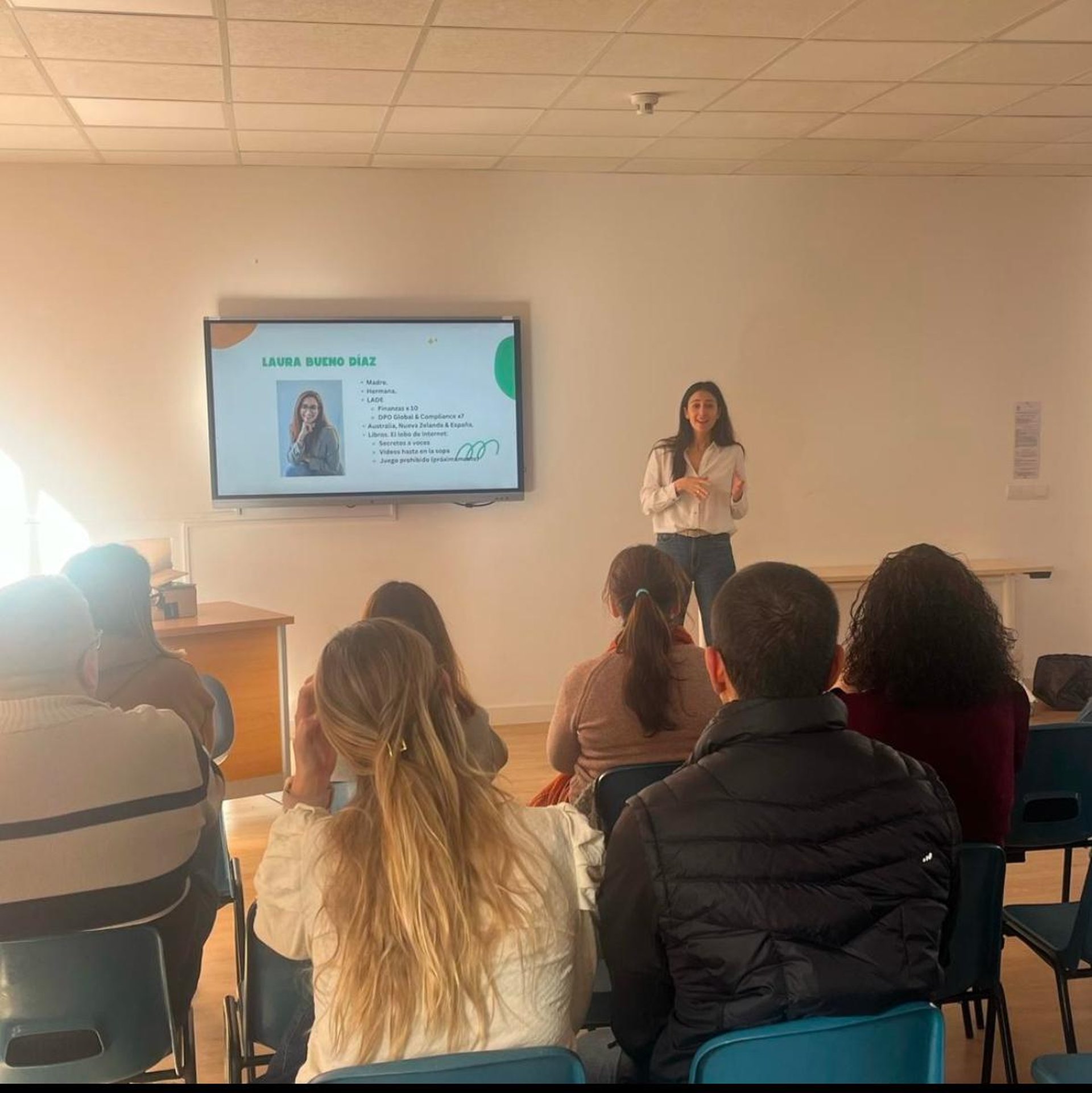 selective focus photography of sitting toddler in red sweater holding book