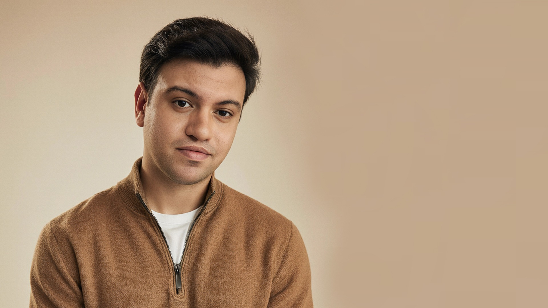 man sitting on purple cushion armchair