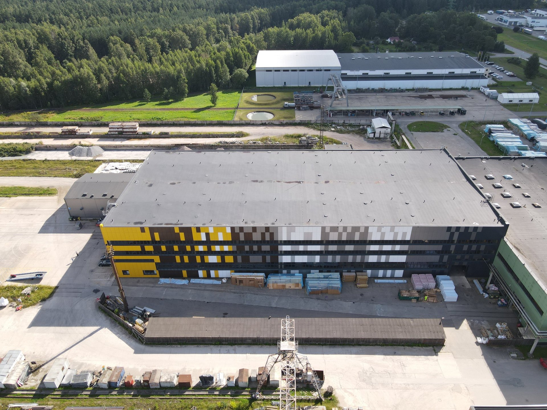 an abstract photo of a curved building with a blue sky in the background