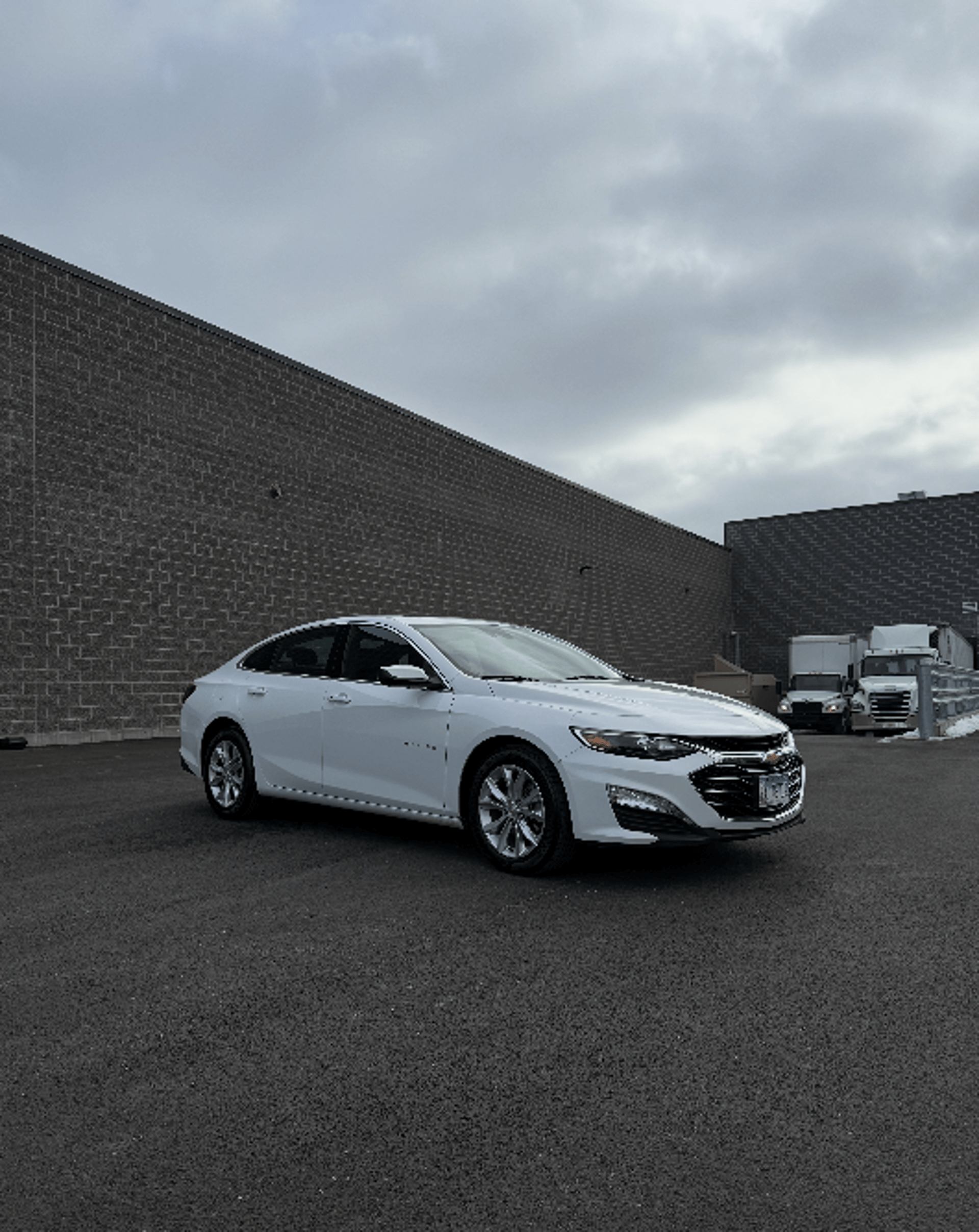 white chevrolet car on road during daytime