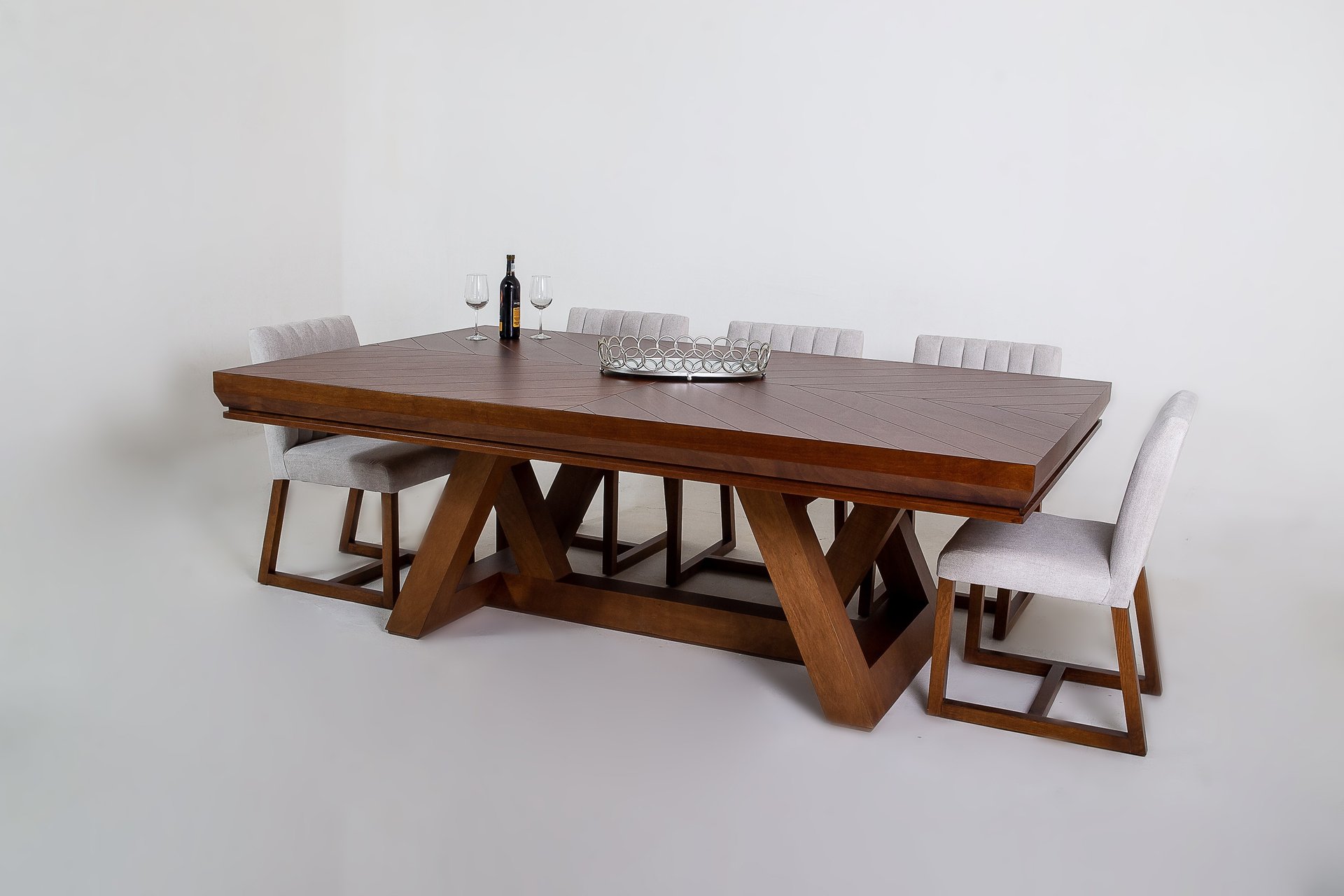 a blue chair and a yellow lamp in a white room