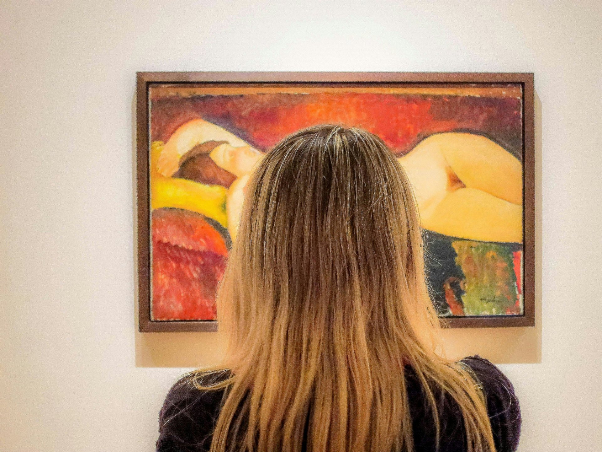 an abstract photo of a curved building with a blue sky in the background