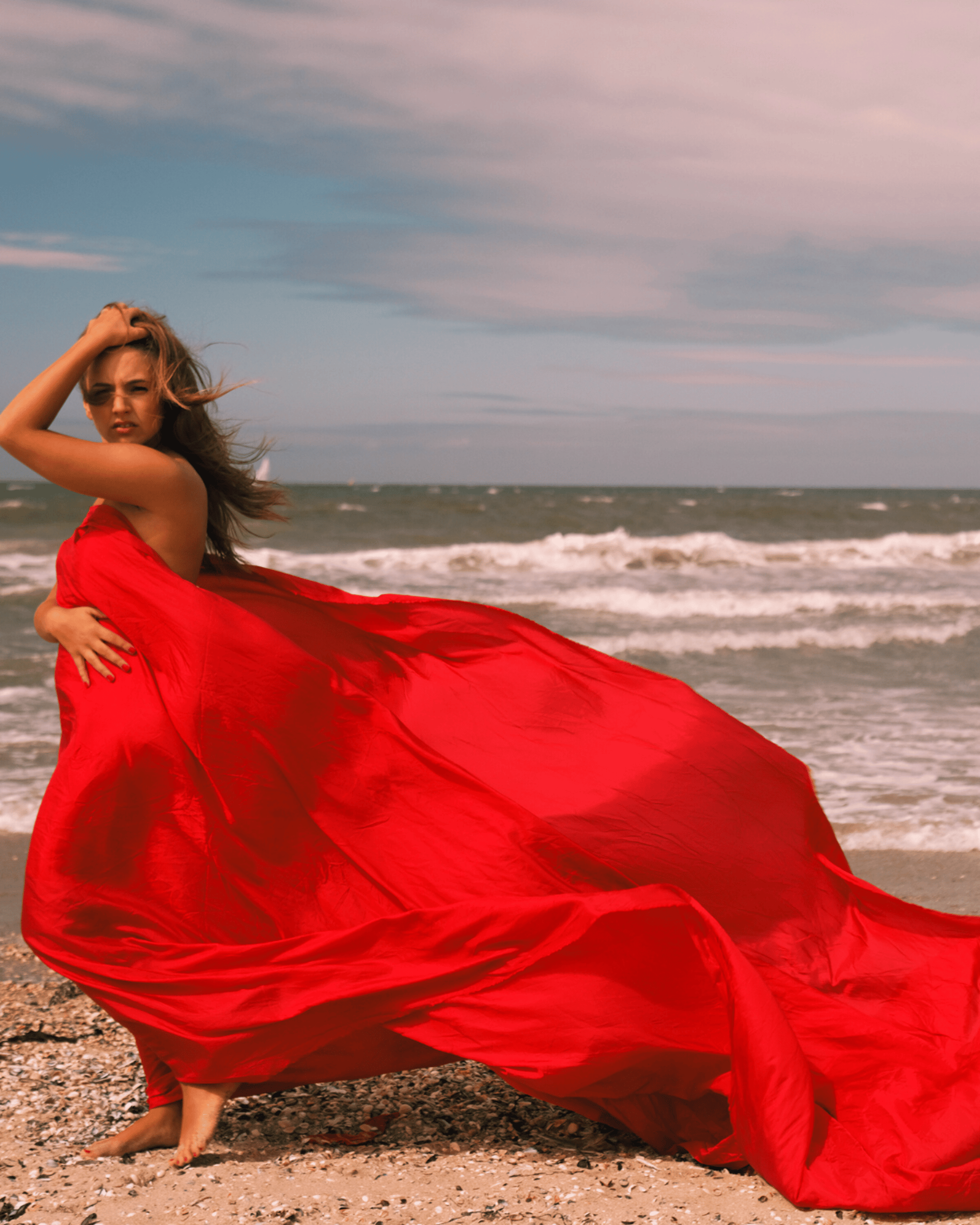 Empowered woman in red dress in the forest, symbolizing financial and spiritual freedom 