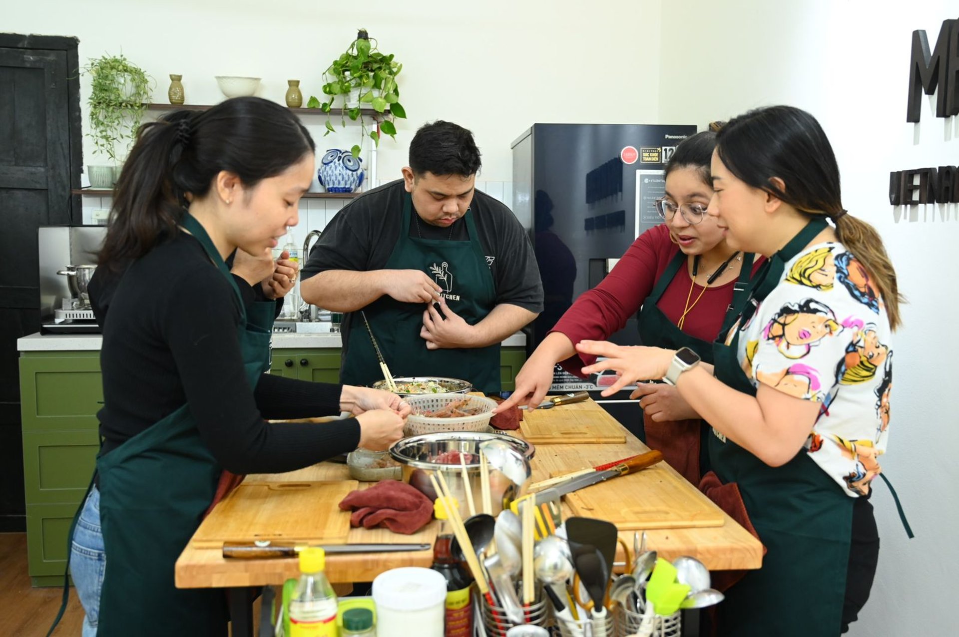 a bowl of food with meat and vegetables on a table