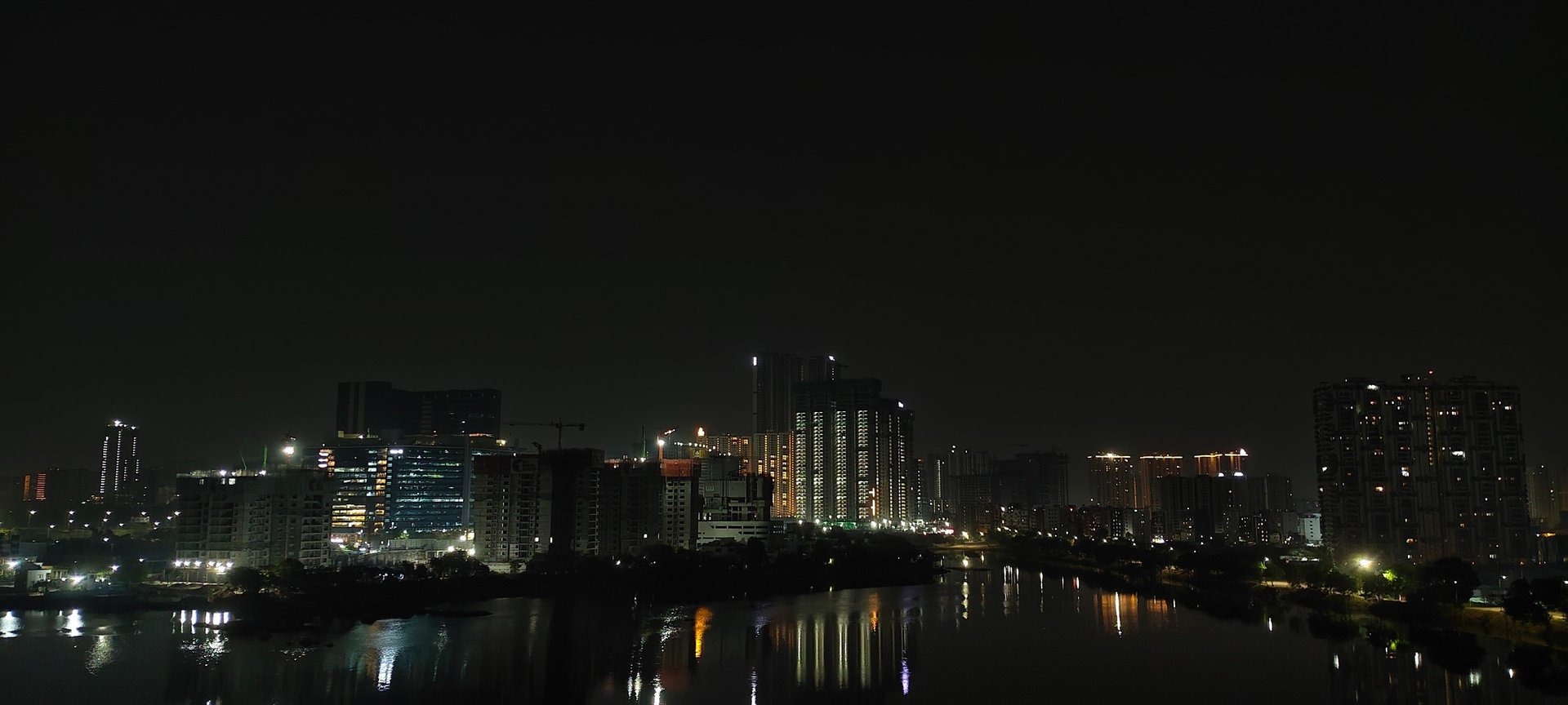 an abstract photo of a curved building with a blue sky in the background