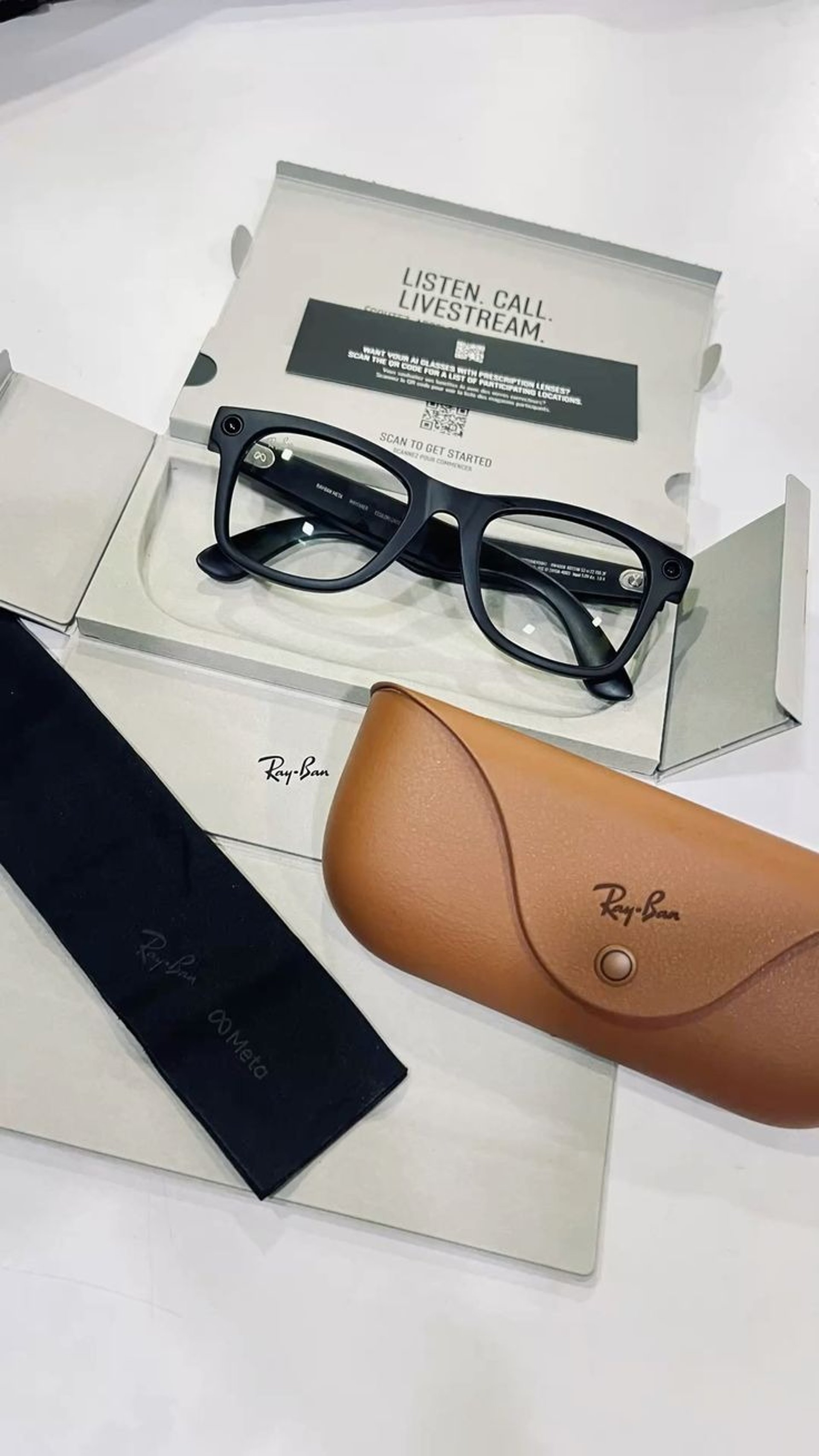 black framed sunglasses on white printer paper