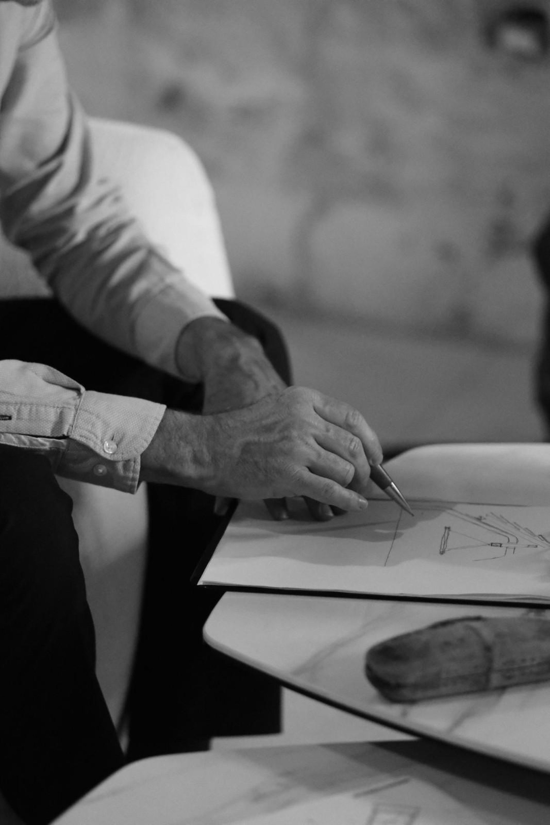 an abstract photo of a curved building with a blue sky in the background