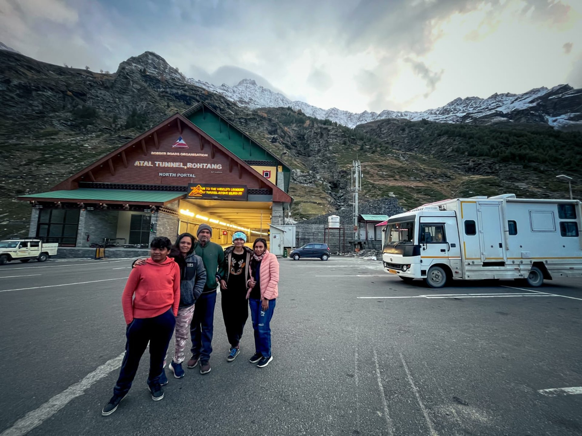 woman wearing yellow long-sleeved dress under white clouds and blue sky during daytime