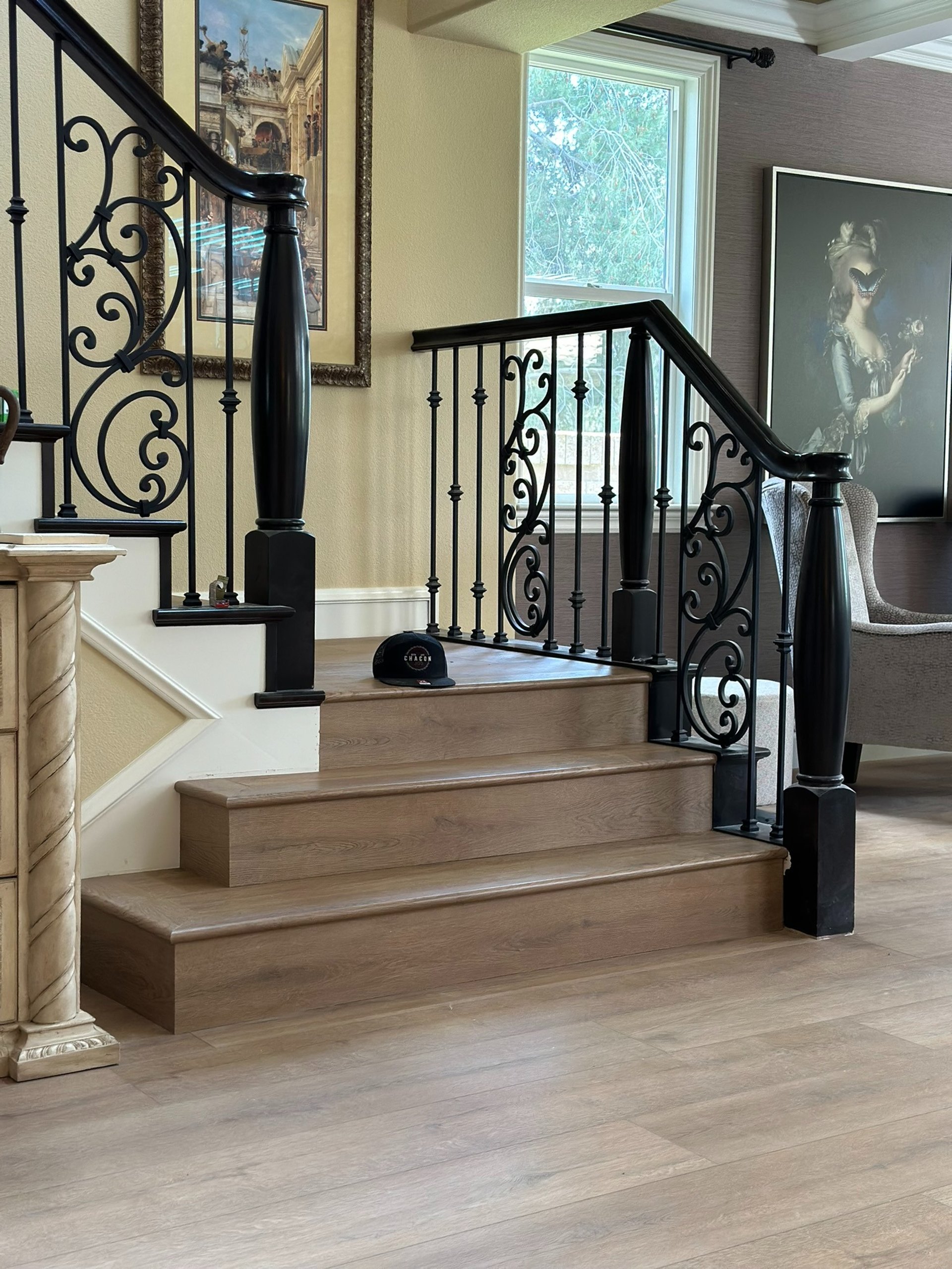 brown wooden staircase near white wall