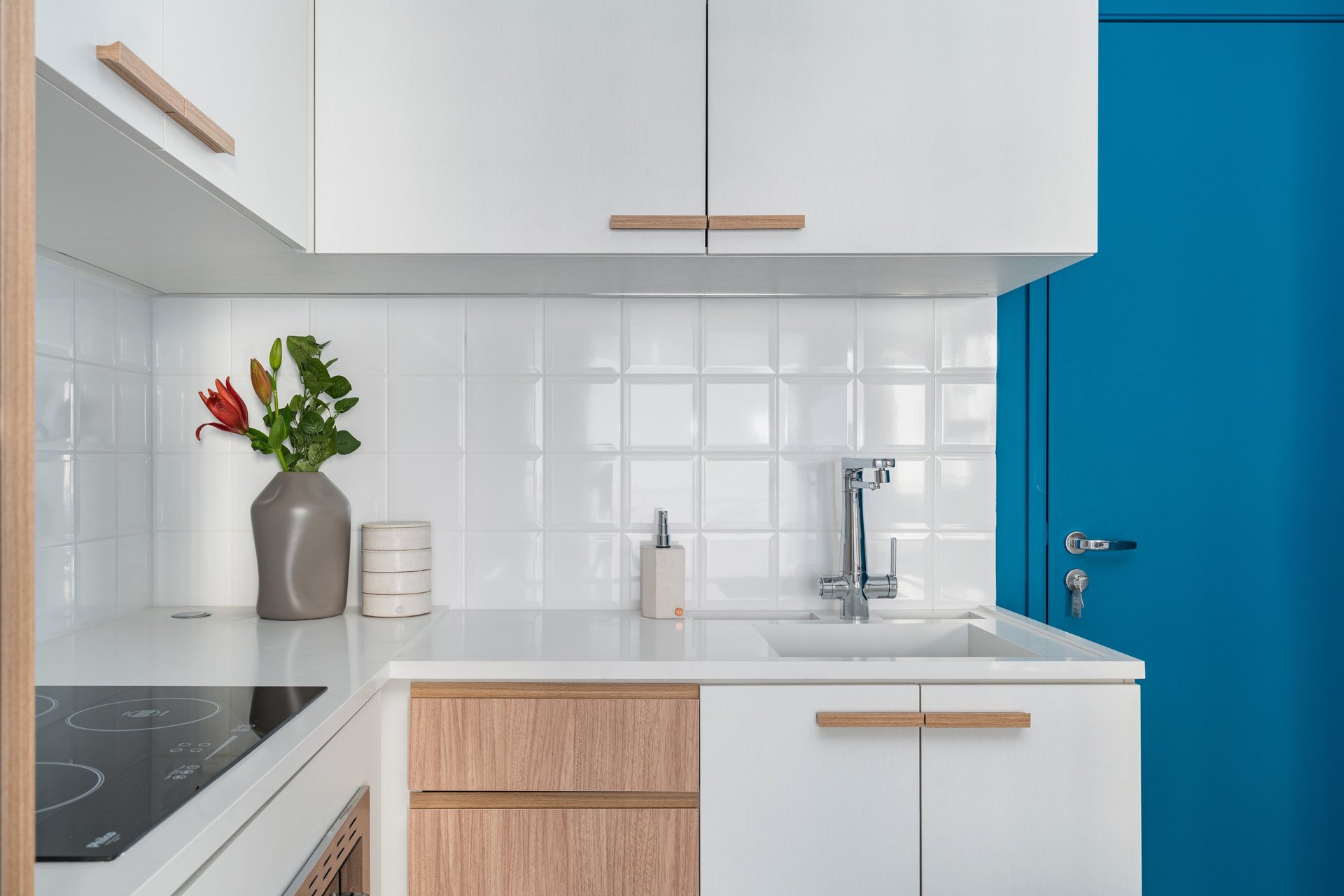 white wooden kitchen cabinet over white kitchen counter