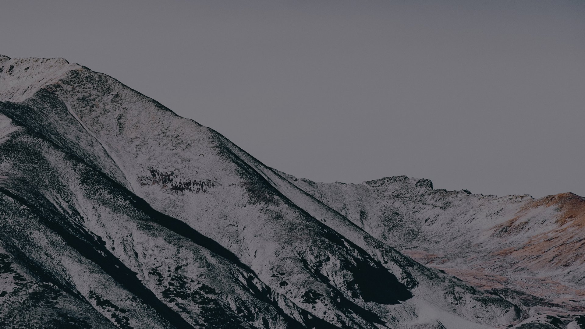 green mountain under white sky during daytime