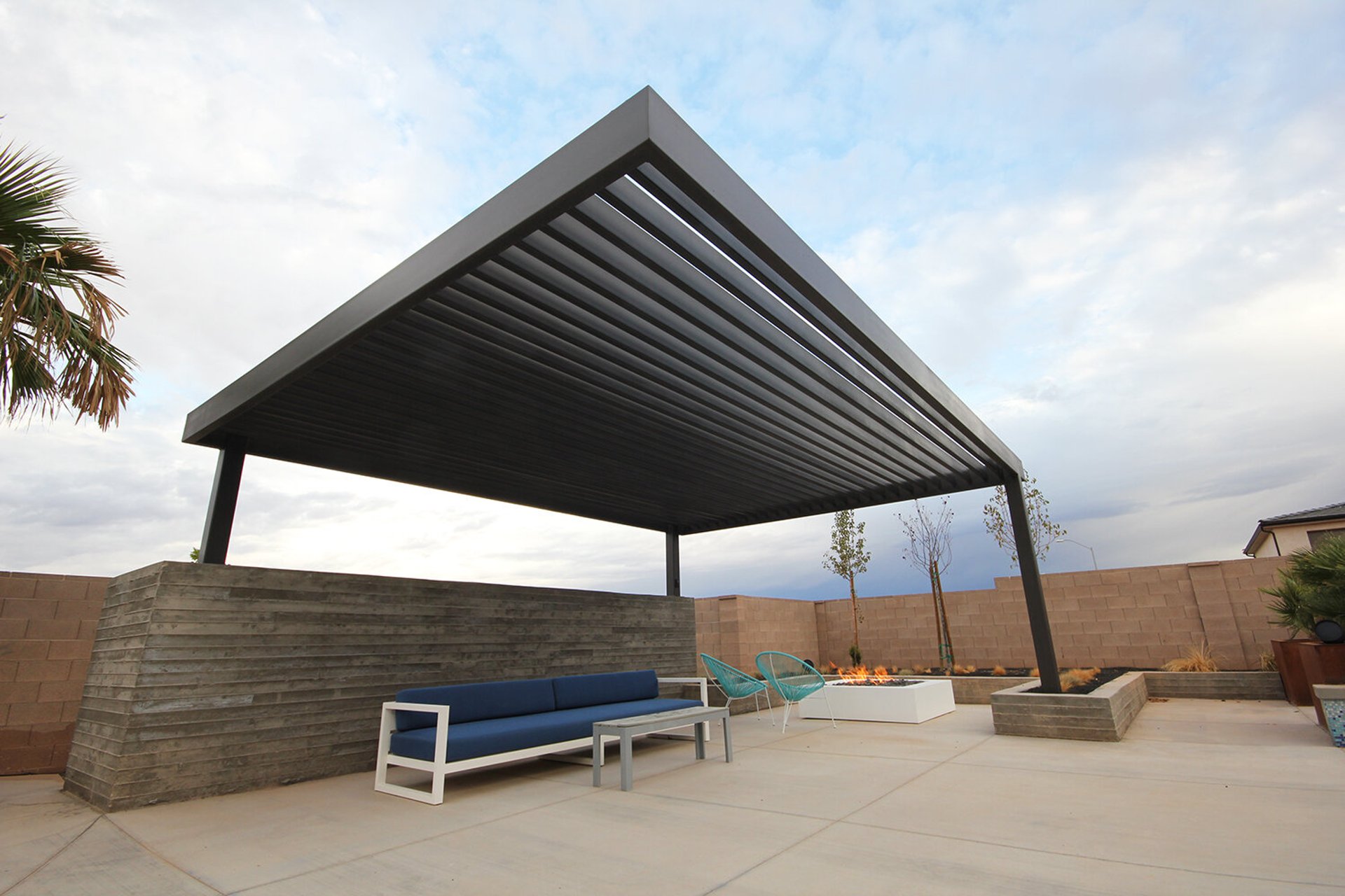 a patio with a couch and a table in it