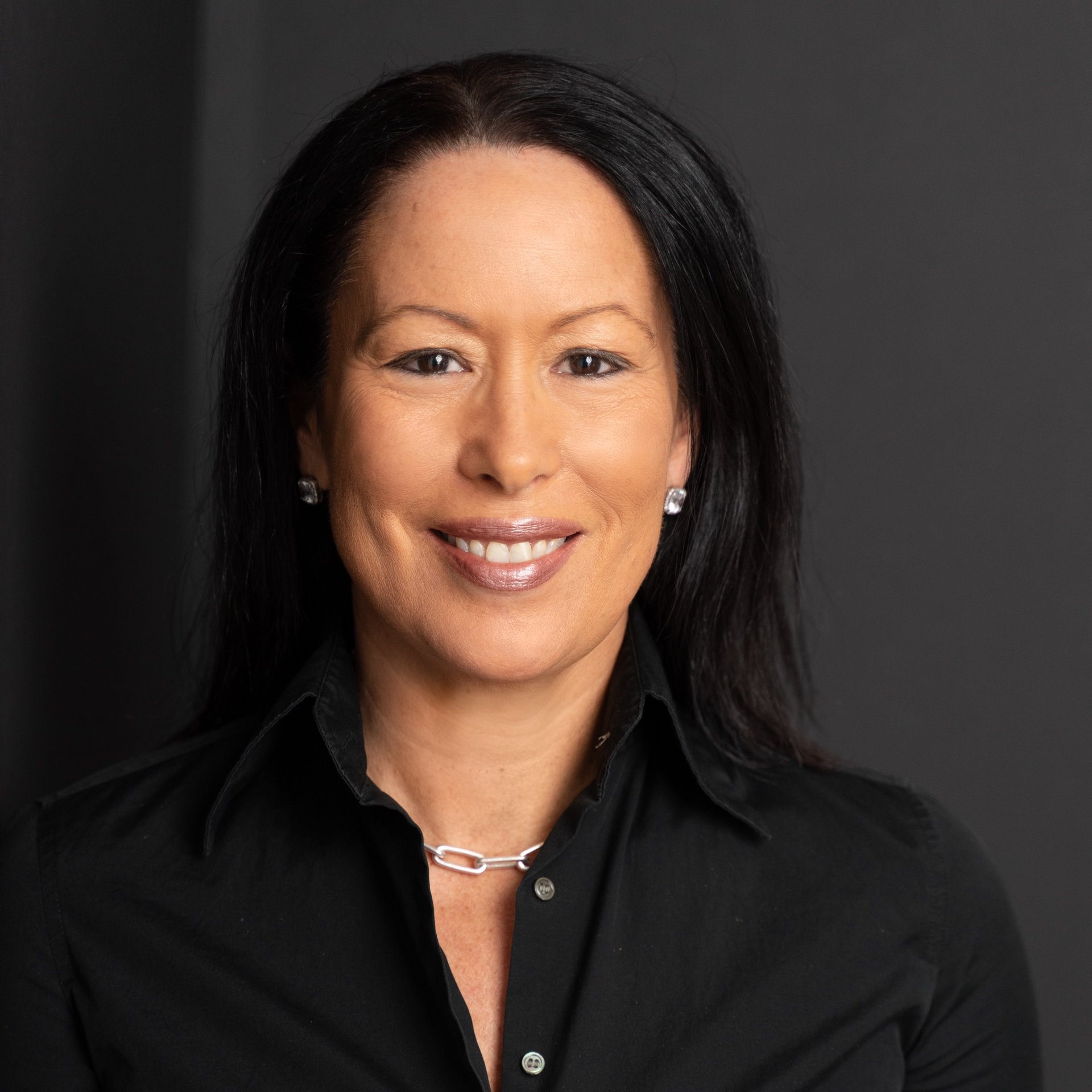 an abstract photo of a curved building with a blue sky in the background