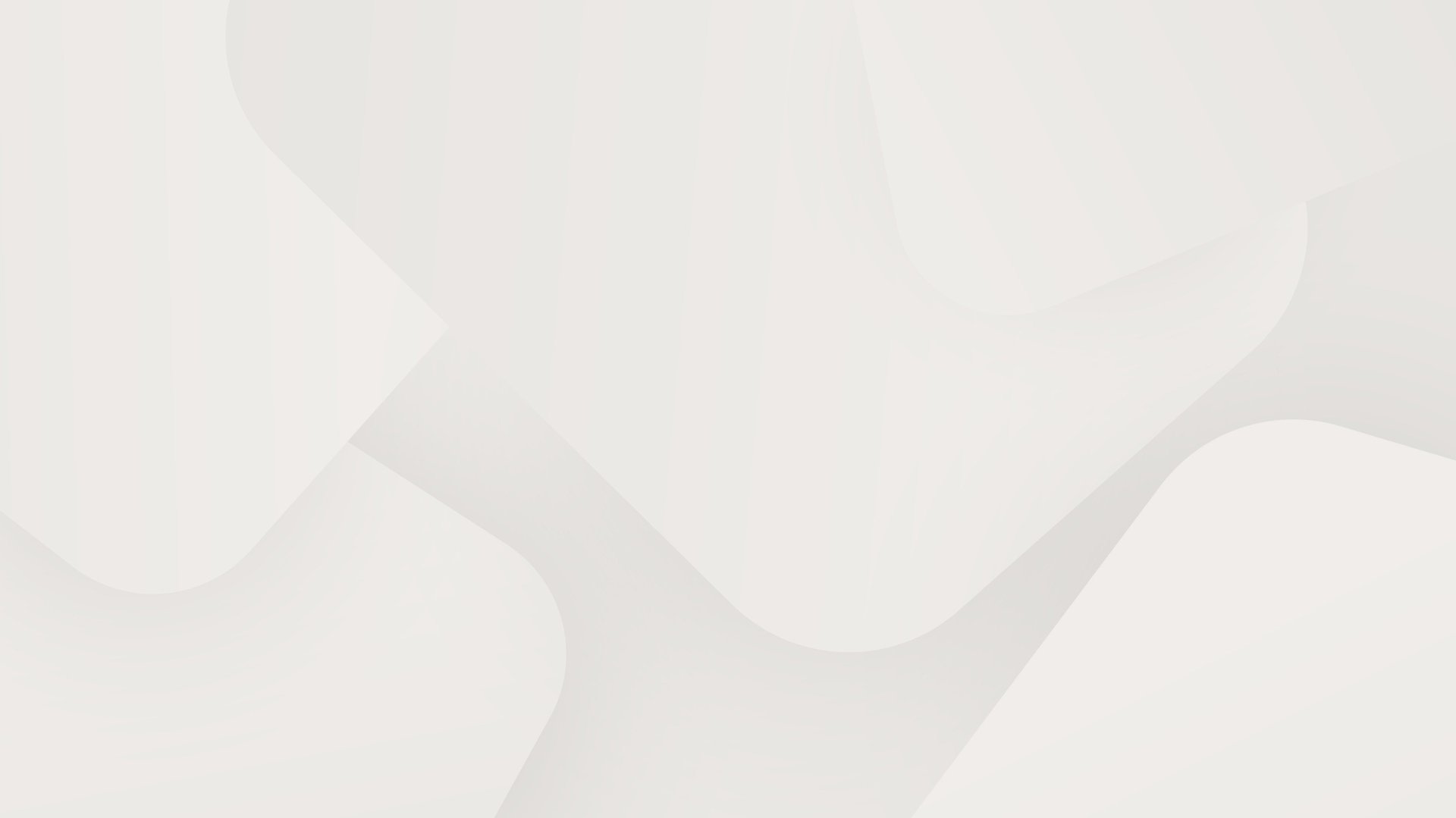 an abstract photo of a curved building with a blue sky in the background